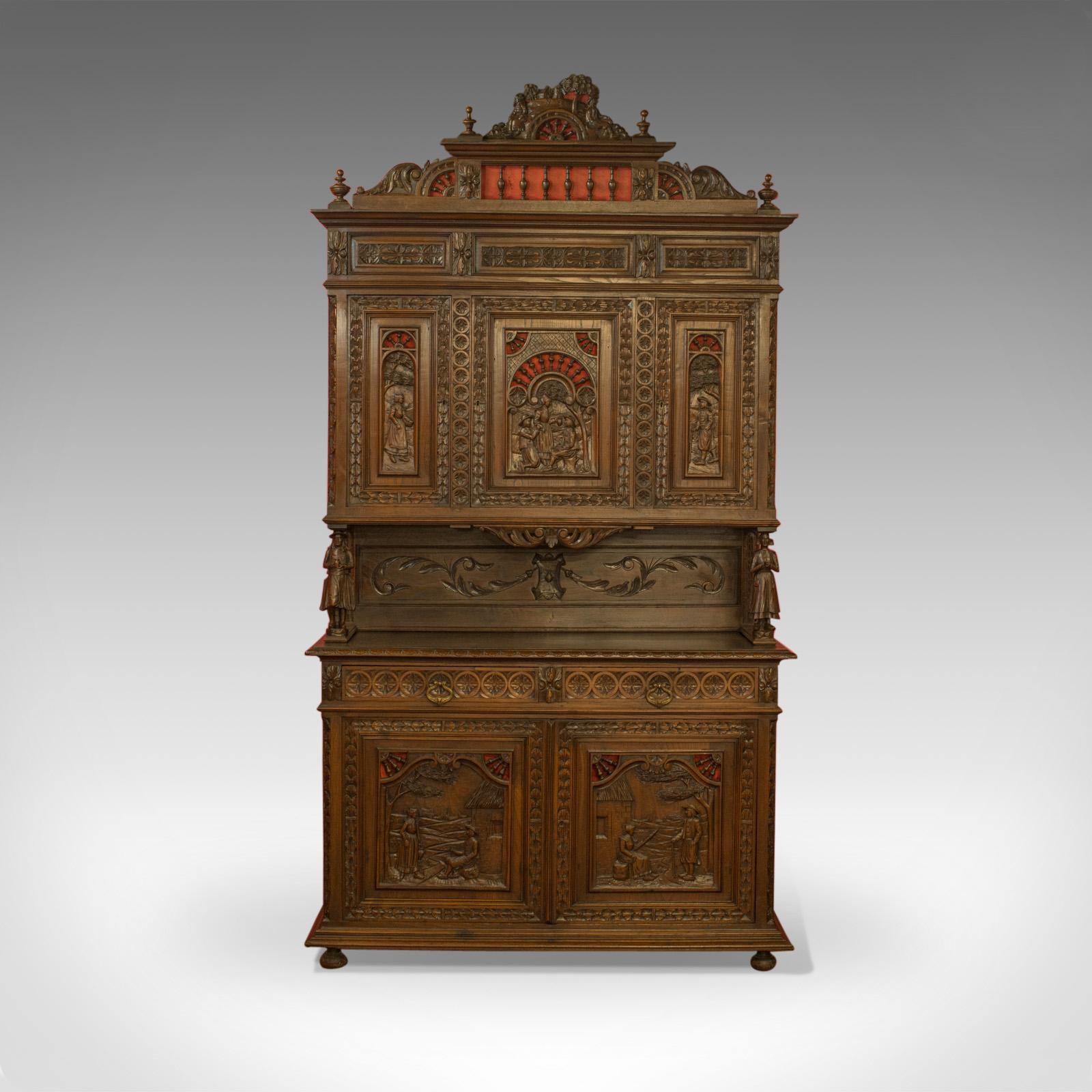 This is an antique carved Breton buffet cabinet. A French sideboard crafted in oak in the late 19th century, circa 1880.

An ornate example of French, Breton cabinetry displaying bountiful detail
Displaying a fine lustre in the wax polished
