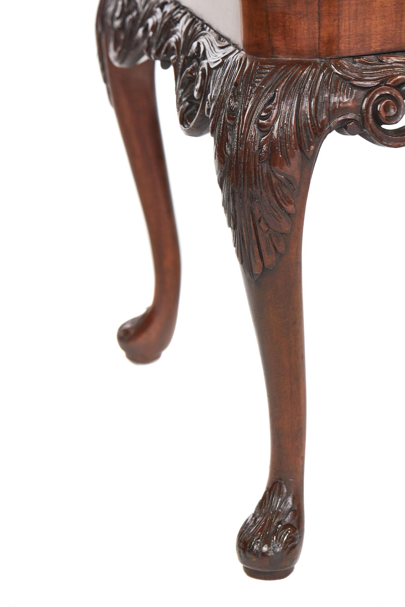 Antique carved burr walnut coffee table having a superior figured burr walnut top with a magnificent walnut pierced carved frieze depicting a scroll and leaf decoration. It stands on four solid walnut cabriole shaped legs with carved leaf detail to