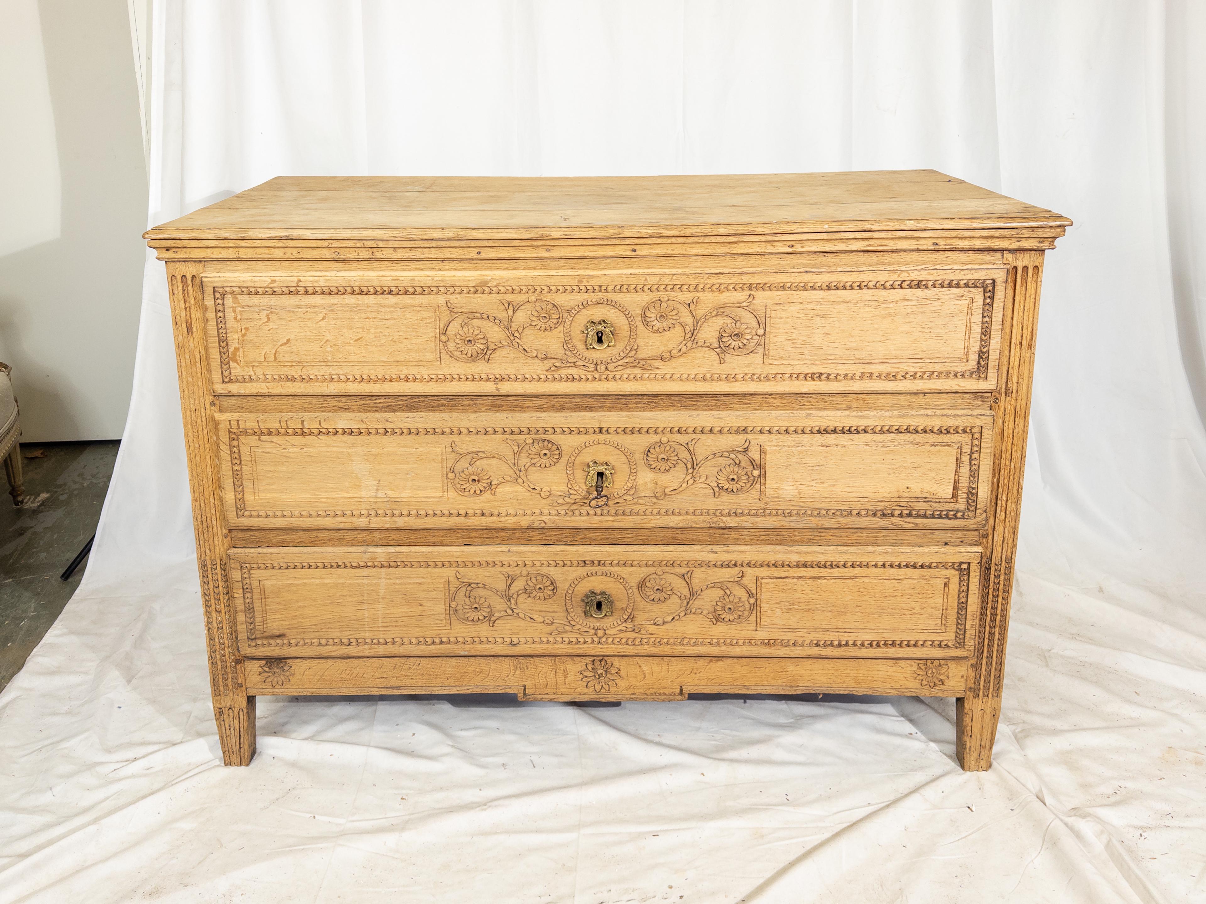 Stepping into the world of Belgian craftsmanship, the Antique Carved Chest of Drawers epitomizes the grace and grandeur of the Louis XVI style. With its intricate carvings and meticulous attention to detail, this piece stands as a testament to the