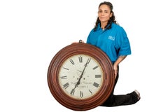 Antique Carved Circular Wall Clock by Wilbur V. Wigans Jewelers