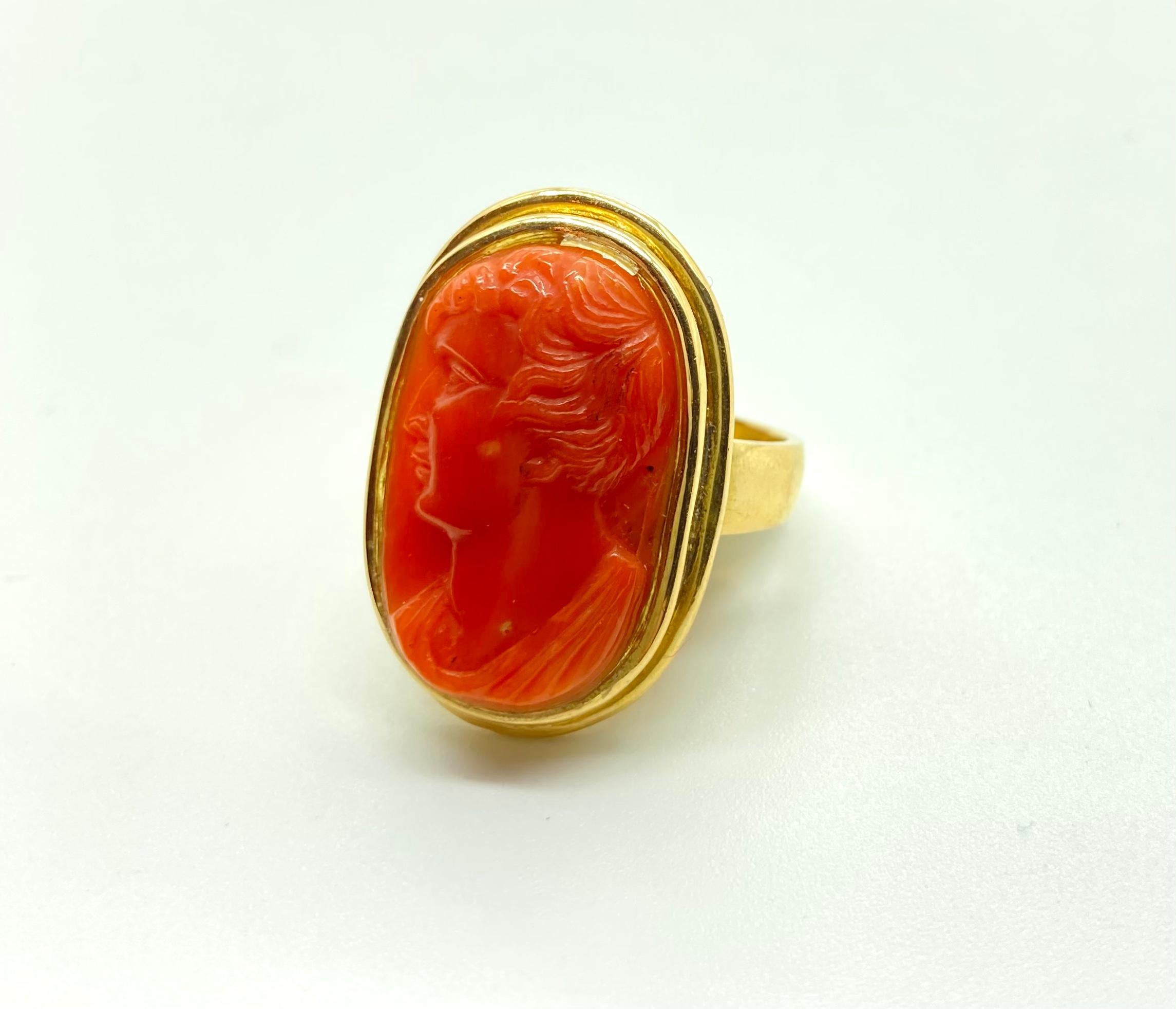 A chic yellow gold ring featuring a carved coral cameo of a gentleman’s profile. Circa late nineteenth century. Made in Italy.