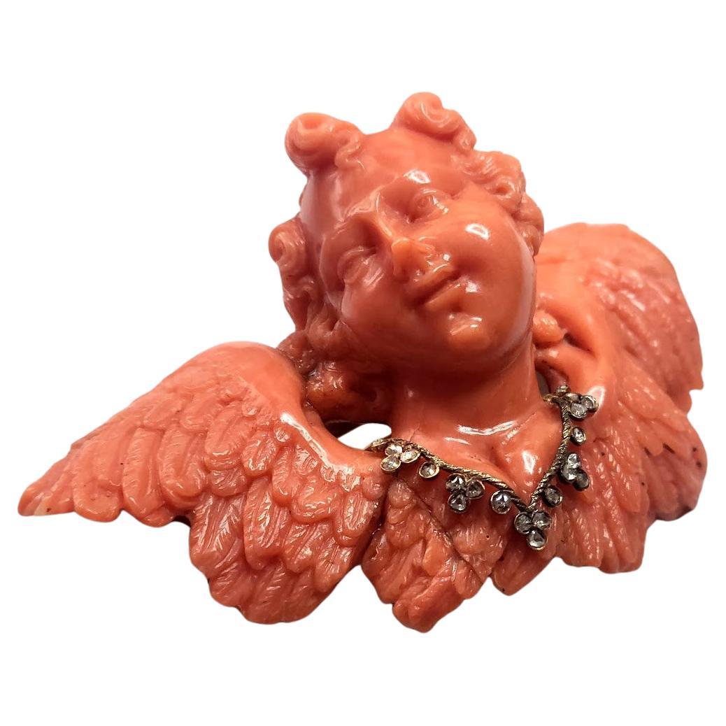 Antique Carved Coral Sciacca, Gold, and Diamond Cherub Brooch For Sale