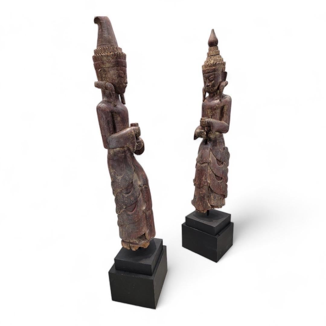 Rustic Antique Carved Dark Brown Lacquered Burmese Monastic Attendants - Set of 2 For Sale
