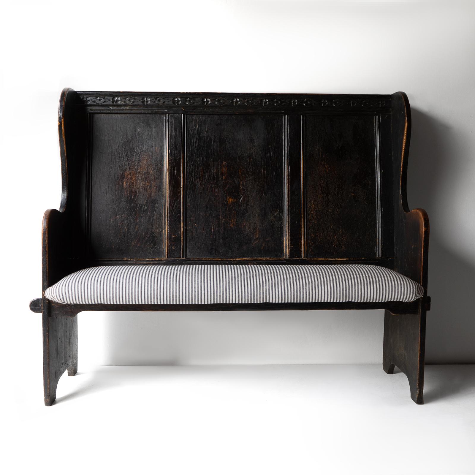 ANTIQUE SETTLE

Originally made to be used to sit next to fires to keep the warmth in homes and taverns settles also make great hall benches or work well in kitchens or dining rooms as seating up to a dining table.

Made from ebonised solid oak this