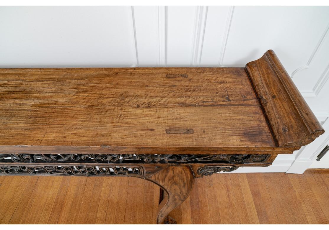 Carved elmwood Northern China altar table featuring fine form and intricately carved apron with bowed legs and curled feet. Each end having a drawer.

Dimensions: 101