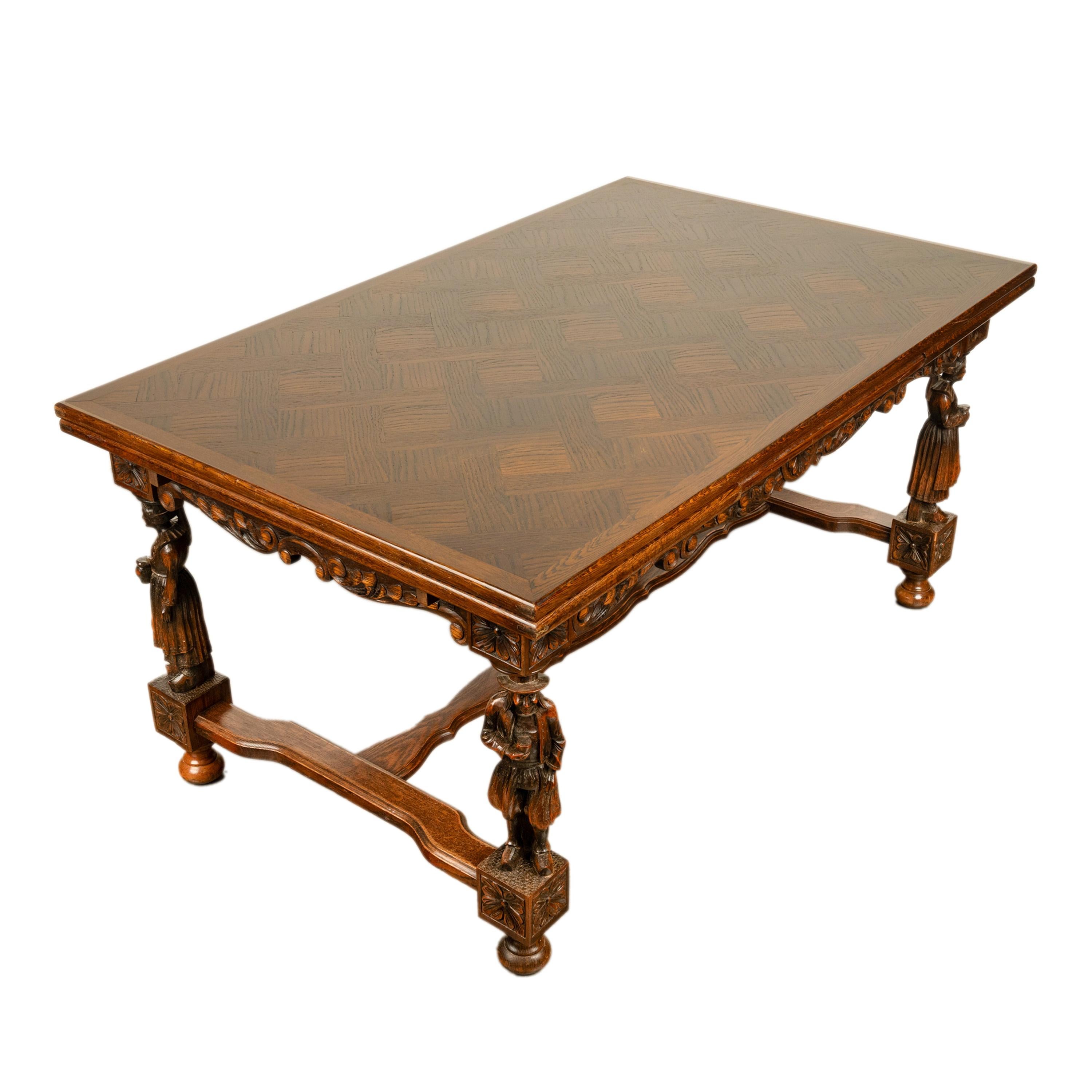 A very good antique carved Breton extending dining table, Brittany France, circa 1900.
The table having a draw leaf at each end that extends to 101