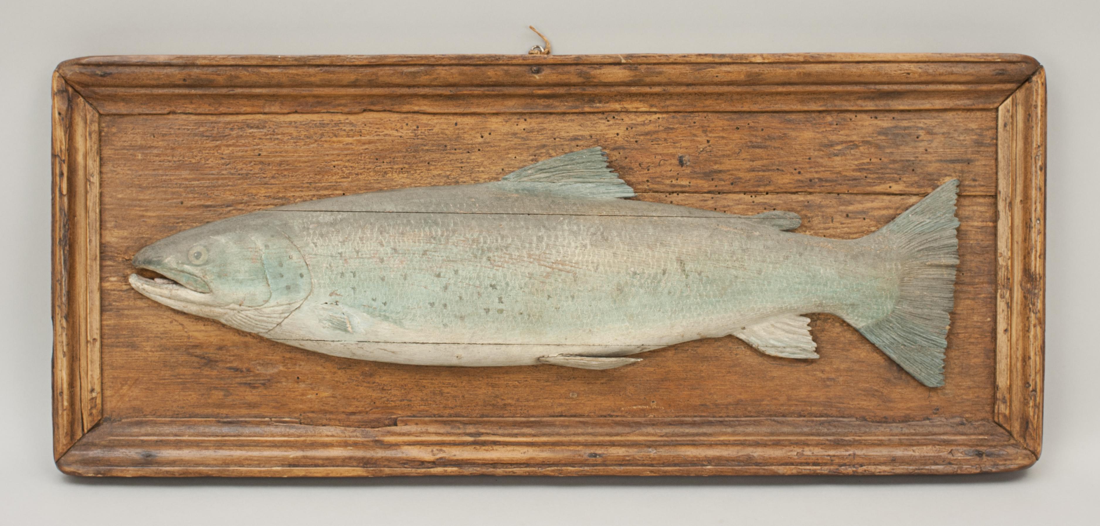 Carved trout trophy fish model.
An excellent carved wooden trout on backboard. The ½ block trout is carved with the dorsal fin, adipose fin, pectoral fin, pelvic fin, anal fin and tail fin. The fish is beautifully executed and painted to a high