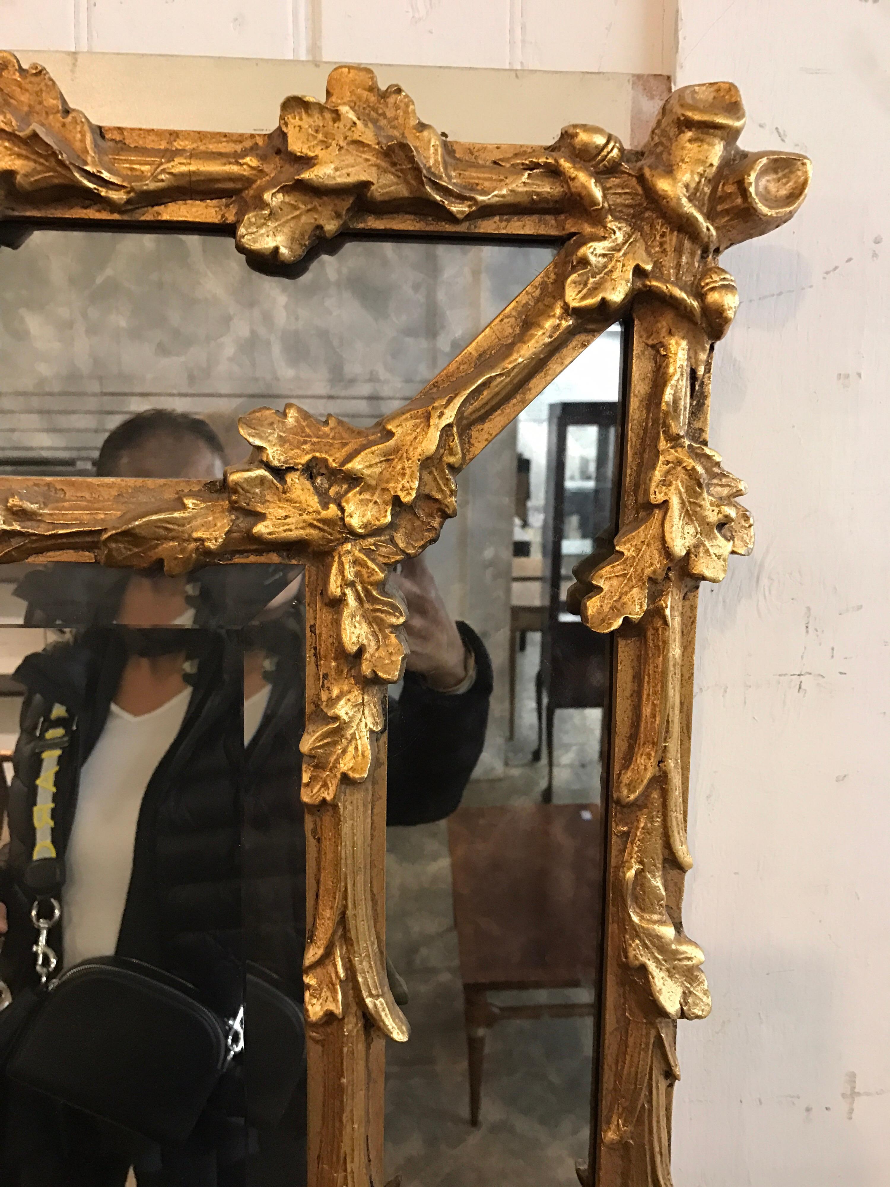 A very fine Italian 19th century Baroque Revival style Florentine giltwood carved mirror frame, with carved branches with oak leaves and acorns scrolled on borders and centred with a beveled mirror plate. All gilt is original and there is also a