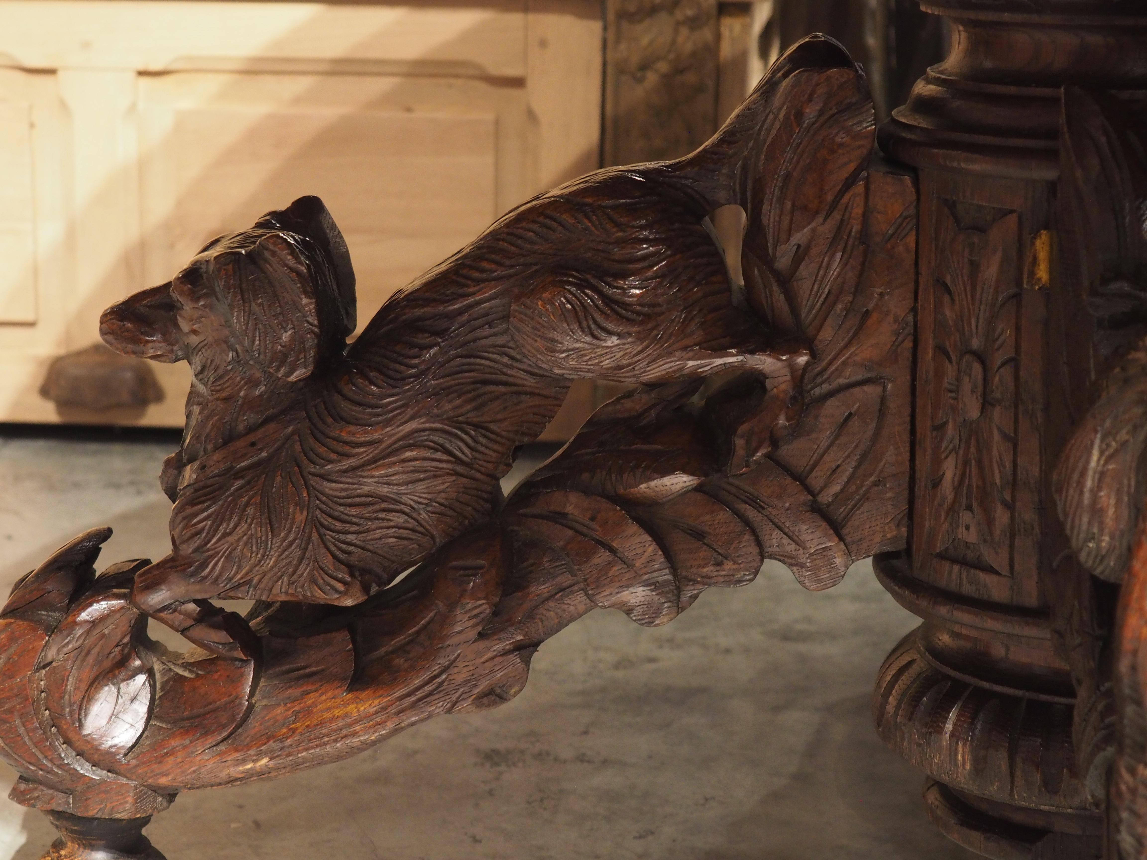 Hand-Carved Antique Carved French Oak Oval Hunt Table with Boar, Dog, Fox, and Stag, c 1890 For Sale