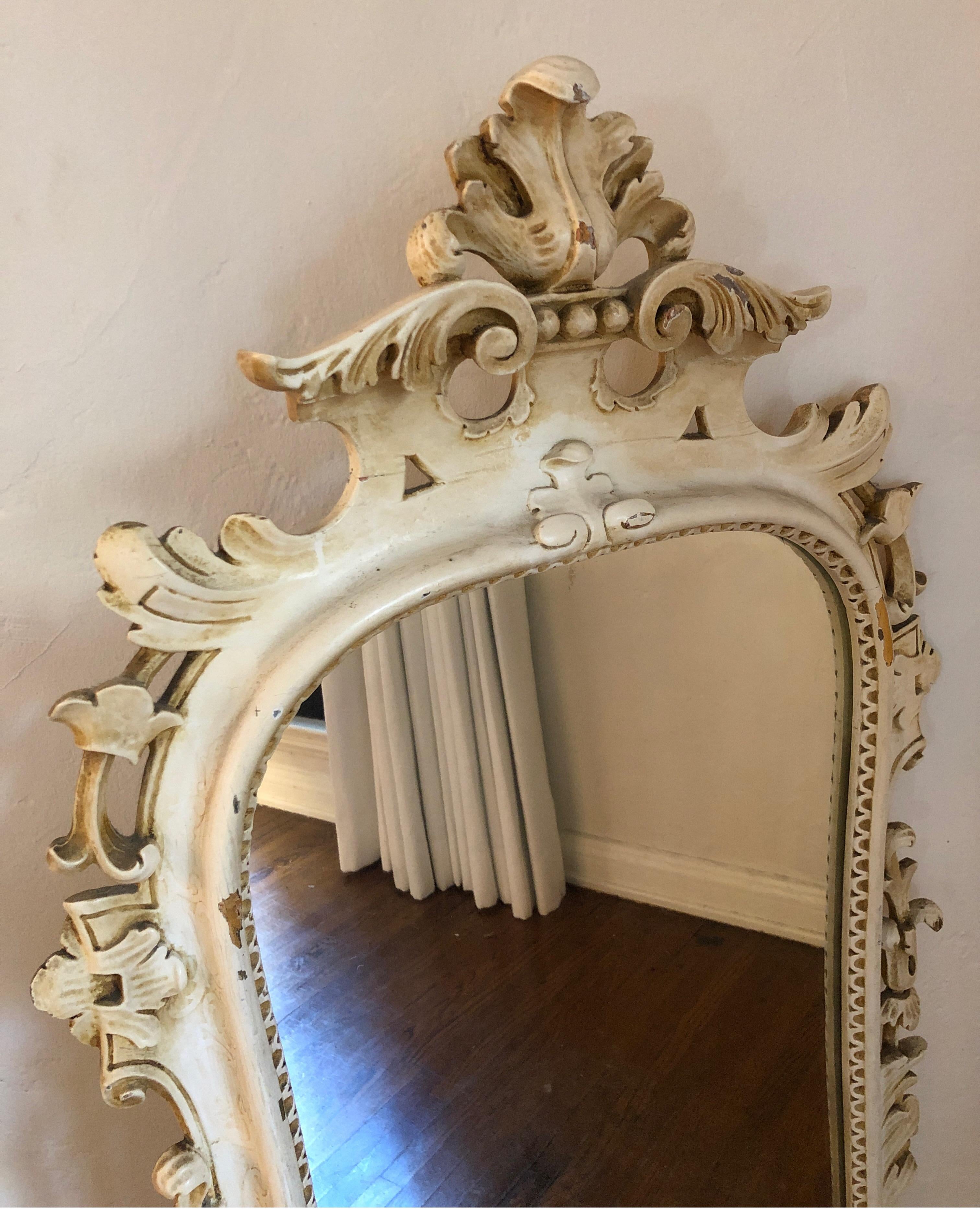 Uniquely carved mirror with leaf details and interesting etching detail around wood near the glass. Also, has a raised scroll pattern detail along the frame. See pic #4. 
Minor gold gilt details. 
Please note there are a couple of chips at the