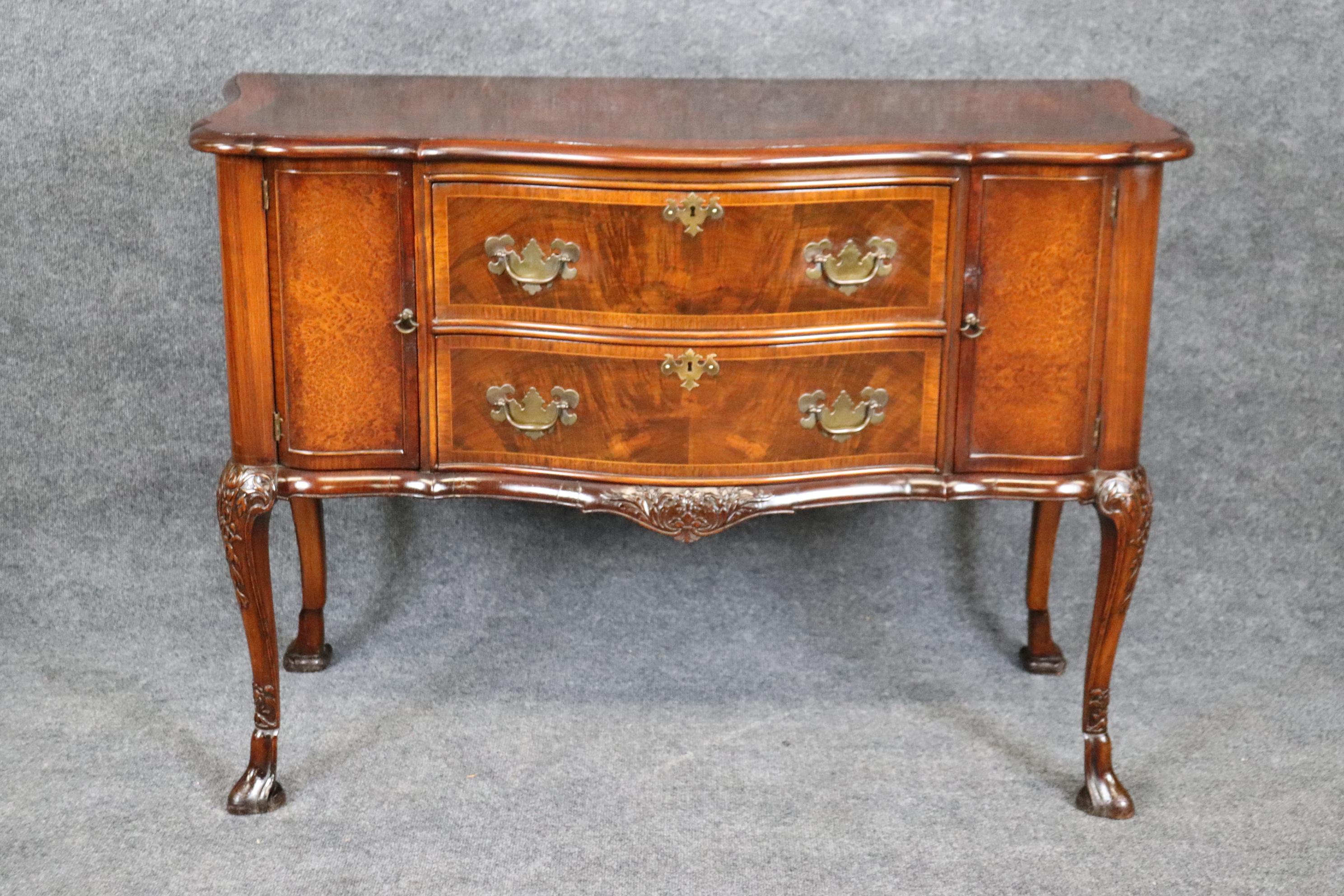Dimensions:  Height: 33 1/4 in  Width: 47 1/4 in  Depth:  21 in

This Georgian style carved mahogany commode buffet chest of drawers is truly incredible!  If you look at the photos provided, you will see the attention to detail in the carvings. This
