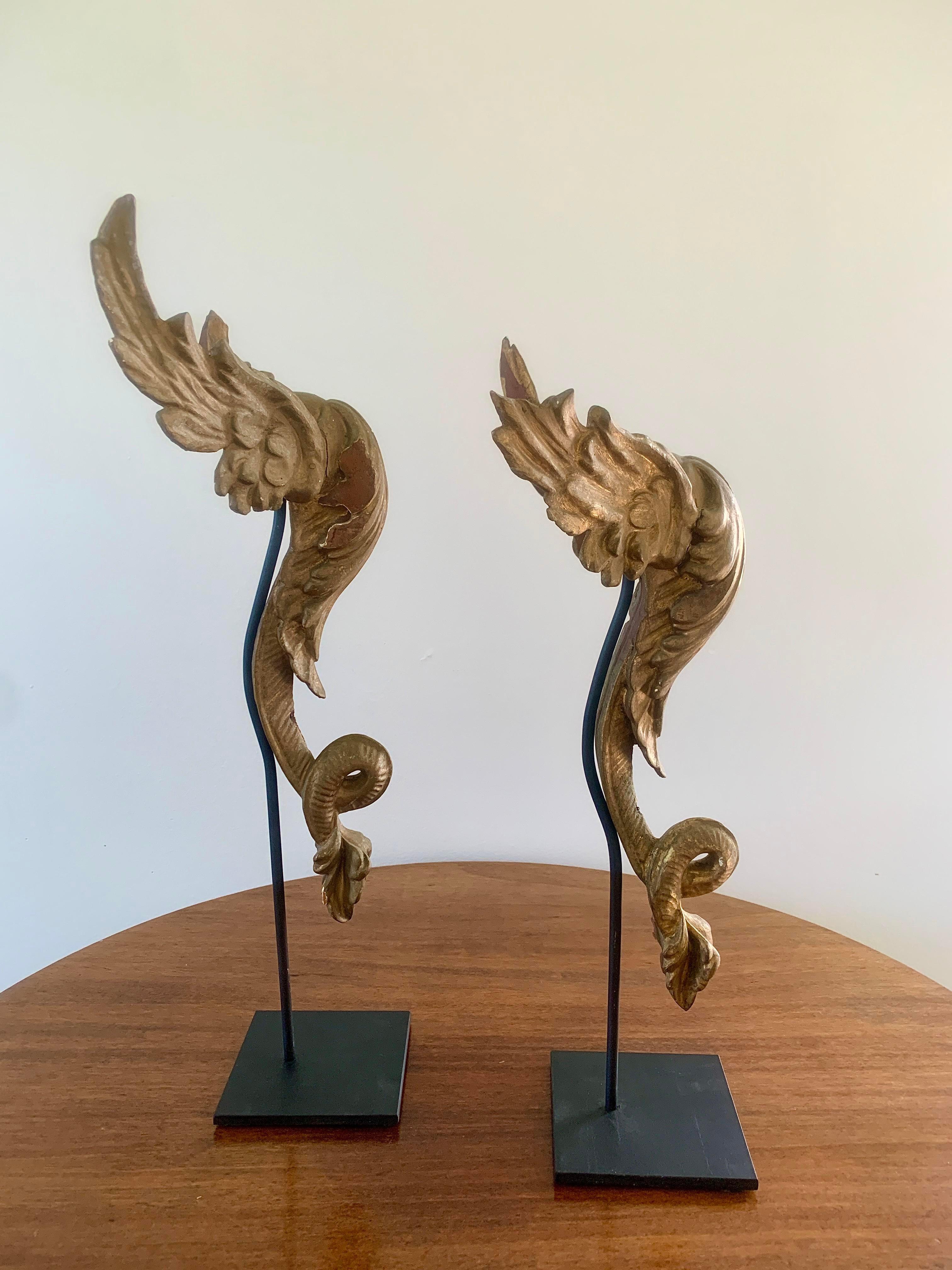 Hand-Carved Antique Carved Giltwood Architectural Winged Fragments with Serpent Tails, circa For Sale