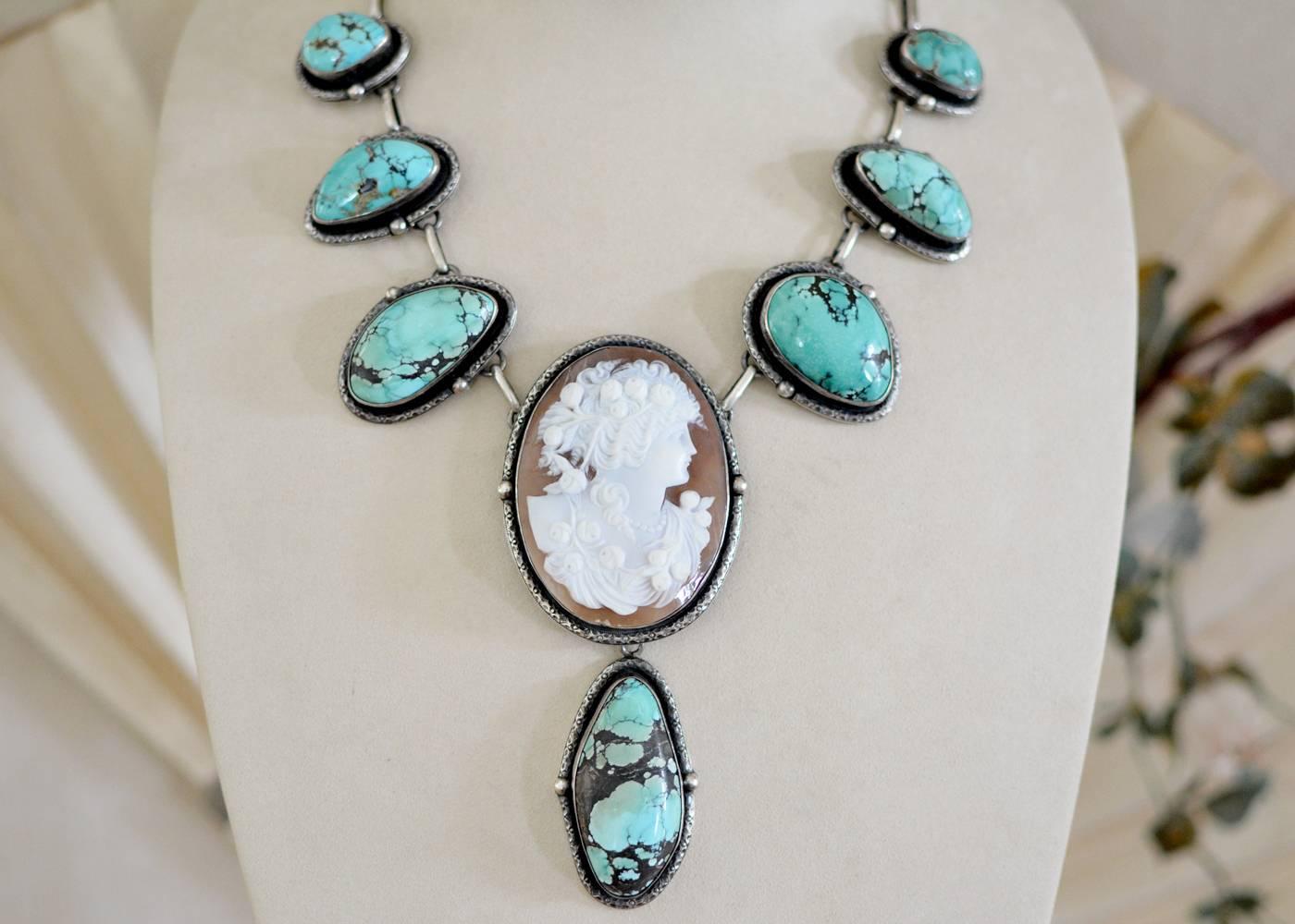 This one of a kind Bohemian necklace features six large naturally shaped turquoise cabochon festoons and a beautiful very fine, highly detailed carved Georgian period Goddess Cameo having a large turquoise drop at the center. Blending periods and