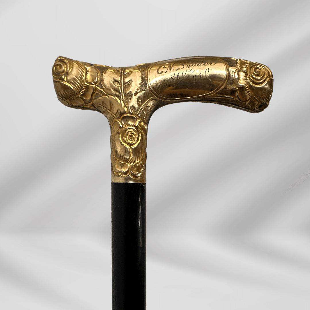Antique Carved Gold Plate Knob Handle Skinner Walking Stick Cane Black Signed In 1860

This antique walking stick has a 2.75