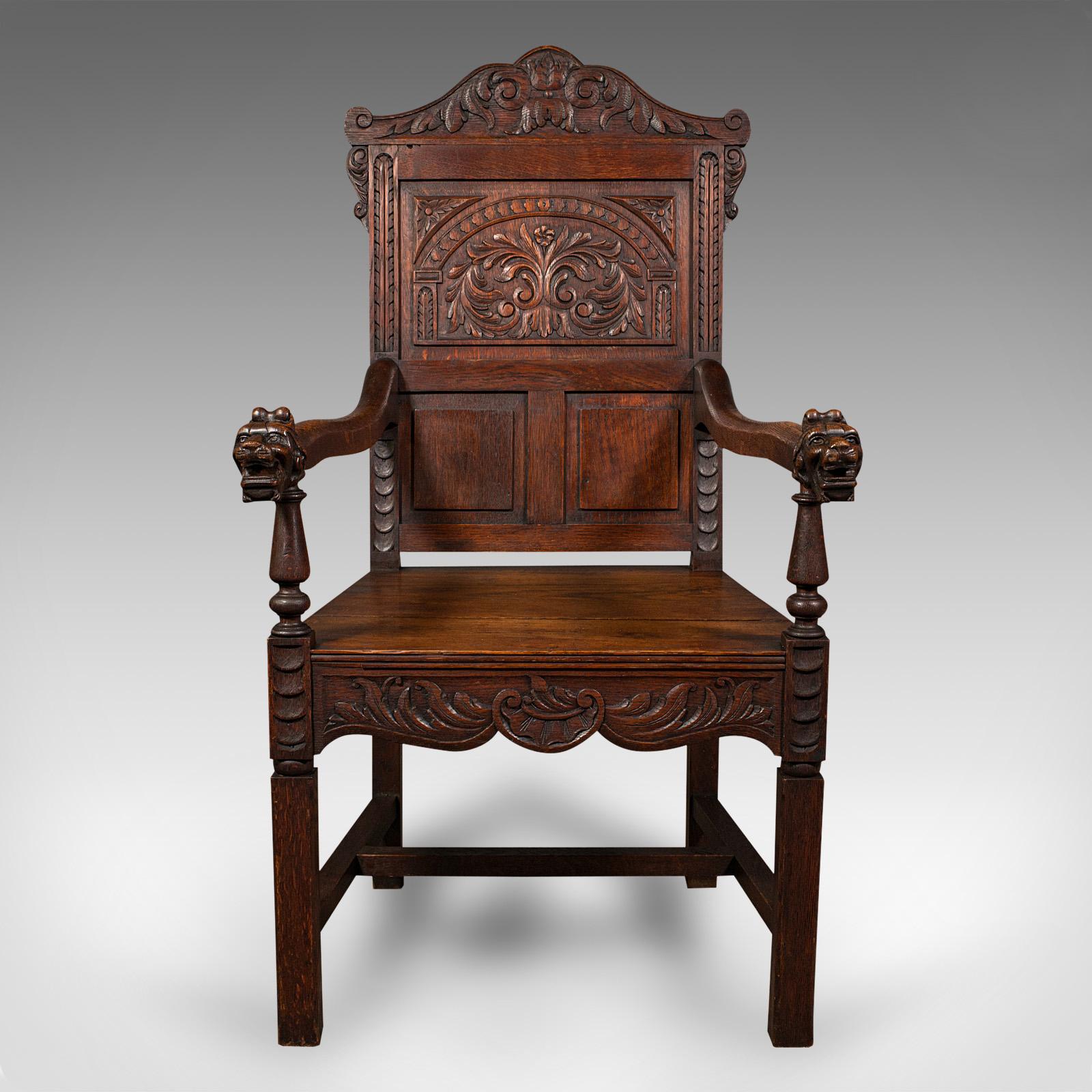 This is an antique carved hall chair. A Scottish, oak decorative elbow seat, dating to the mid Victorian period, circa 1860.

Of superb carved appearance and excellent proportion
Displays a desirable aged patina and in good order
Select oak