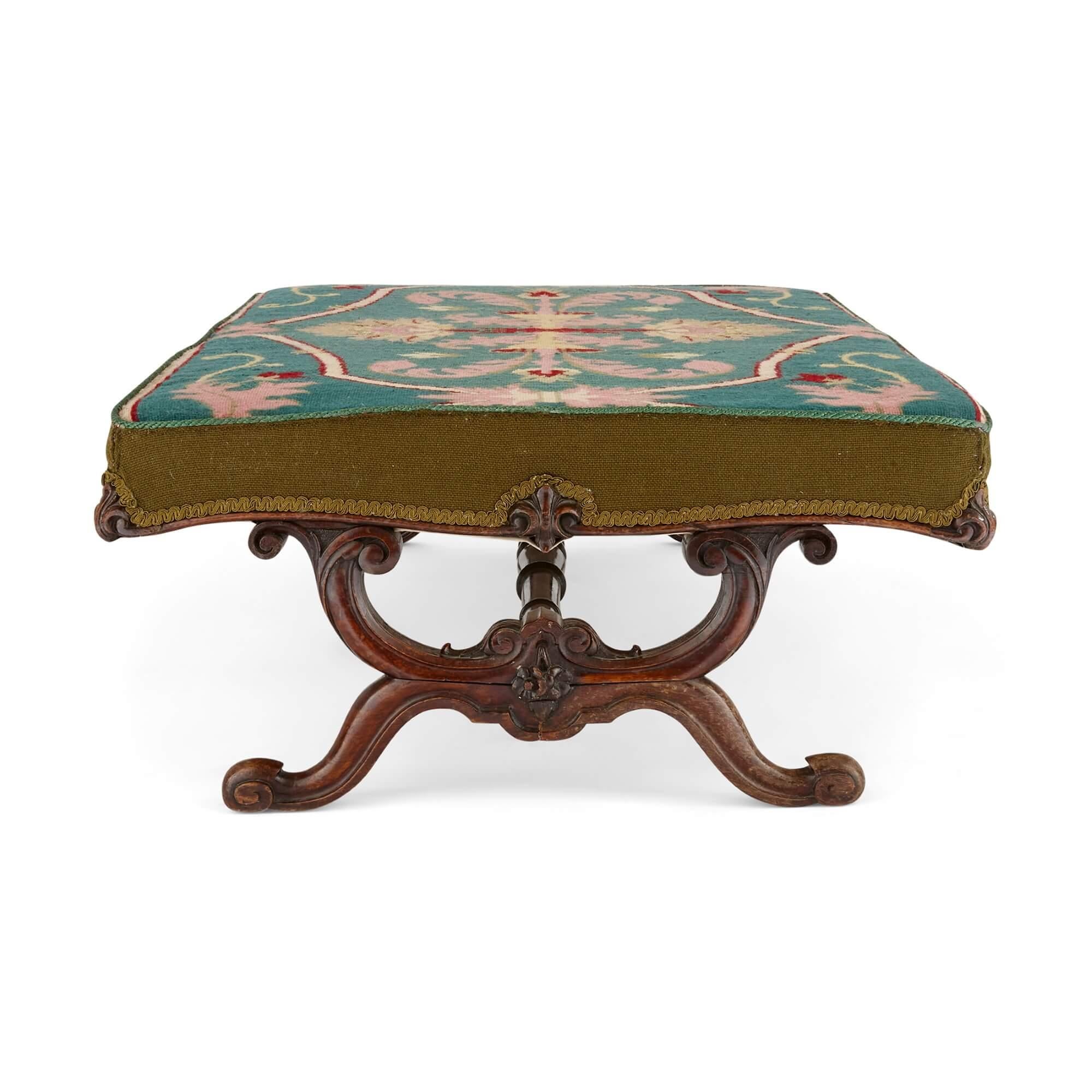 Antique carved hardwood and upholstered Victorian stool
English, Late 19th century
Height 37cm, width 120cm, depth 79cm

Finely carved and upholstered with an elegant floral period Victorian tapestry, this large, wide stool was made in England