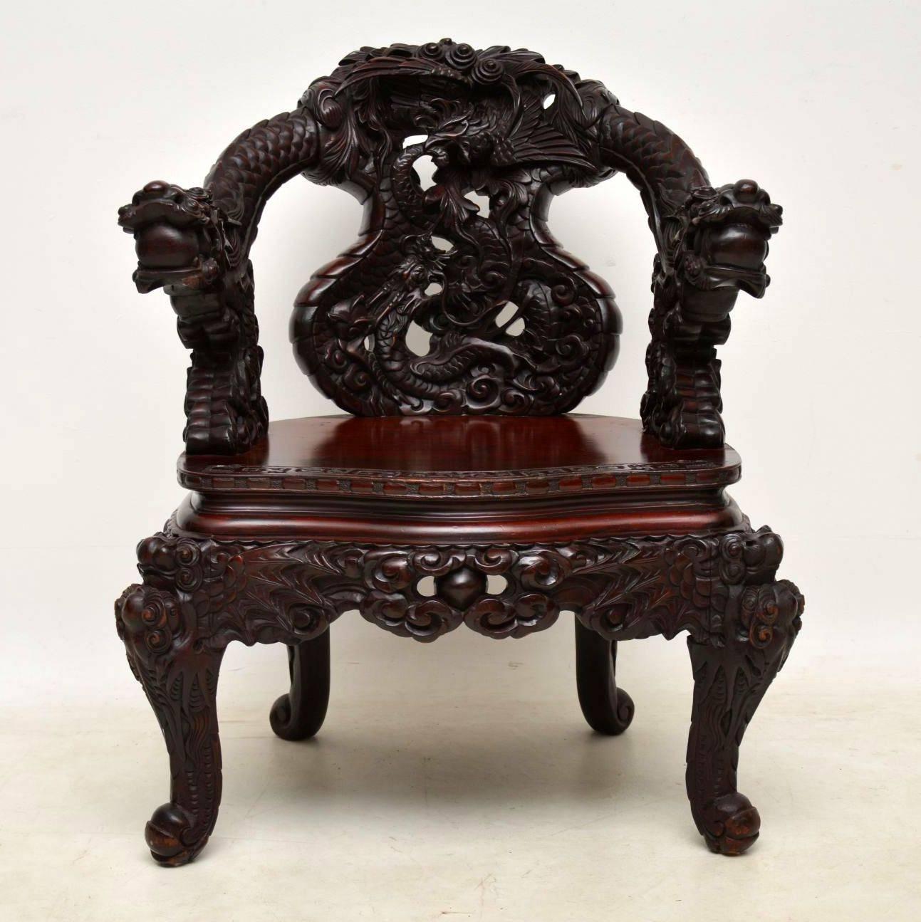 This spectacular looking rare antique armchair I believe is Chinese and it has amazing deep carvings all over. It dates to circa 1890-1910 period and is in excellent condition having just been polished. I can't possibly describe all of the details,