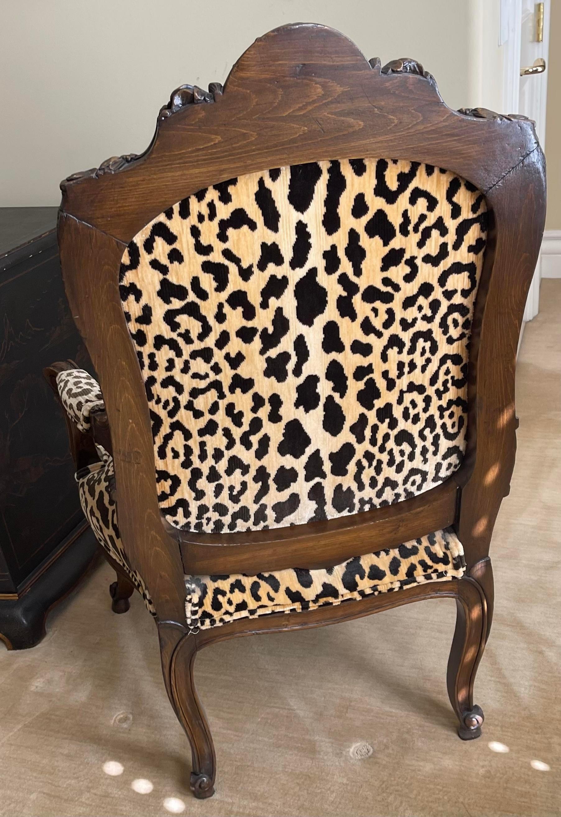 Antique Carved Italian Walnut arm chair with Scalamandre Leopardo Silk Velvet.