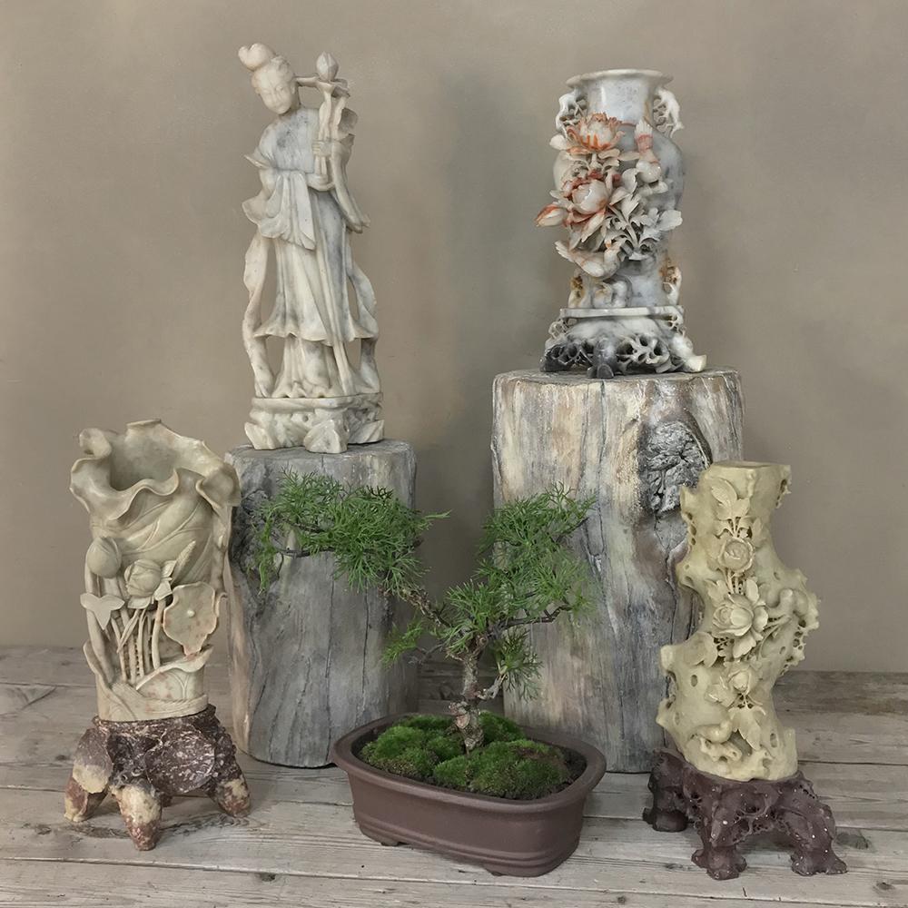 Antique carved jade stone vase is a wonderful sculpture with floral motif, where the artist has taken advantage of the natural beauty of the stone. Intricate details depict a naturalistic setting complete with flowers and birds with a base that