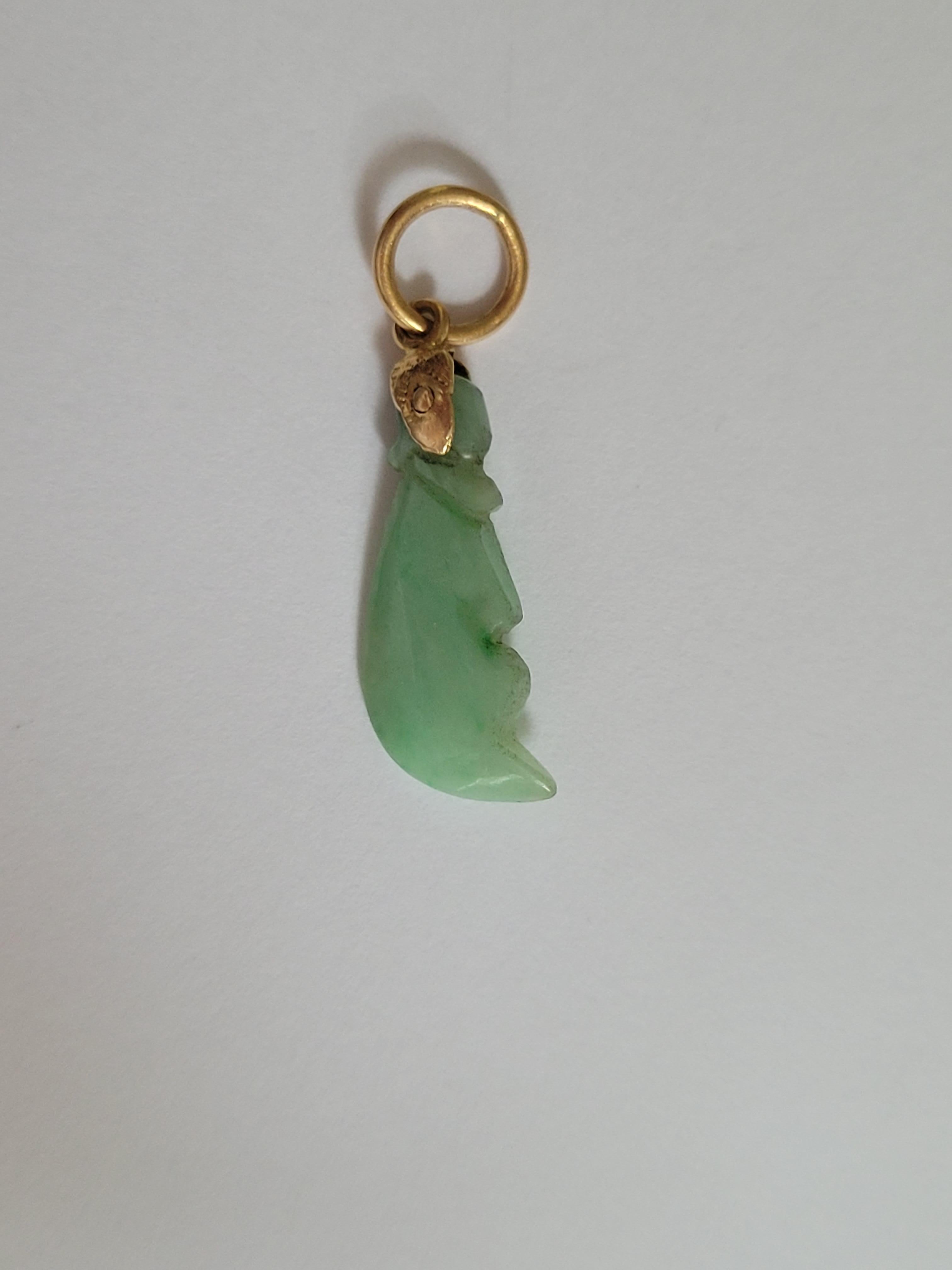 A Lovely Antique early 1900s Yellow Gold and Carved Jade charm pendant. An eye catching piece of jewelry, perfect for adding color to everyday or special occasion outfit. Oriental origin.
Total drop including top rings 27mm, width 9mm.
Weight