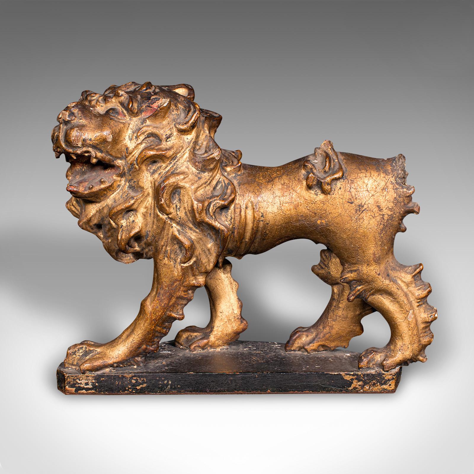 
This is an antique carved lion figure. An English, giltwood decorative desk or mantle ornament, dating to the mid Georgian period, circa 1750.

Charmingly original lion, with lovely colour and good detail
Displays a desirable aged patina and in