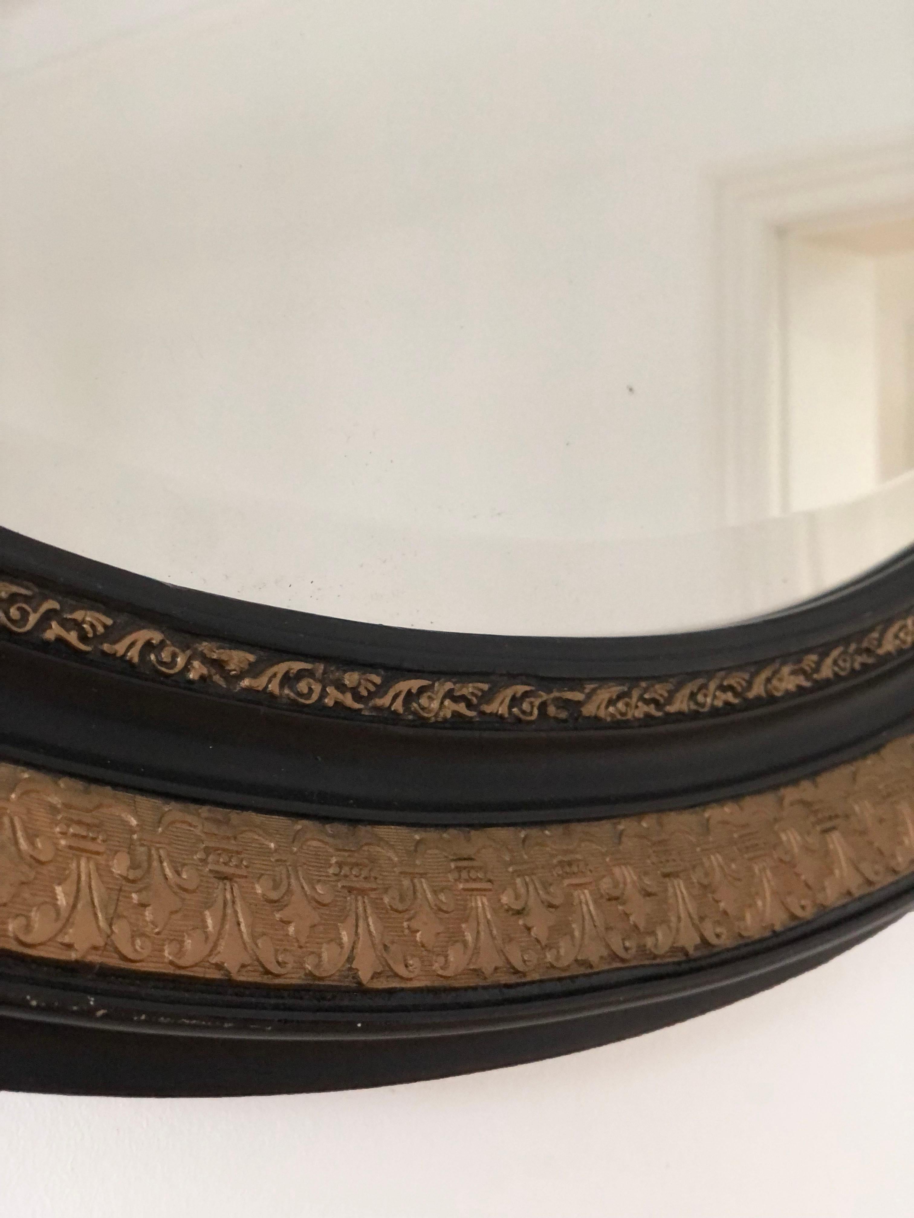 French Antique Carved Louis Philippe Oval Mirror In Black and Gold France Late 19th Cen