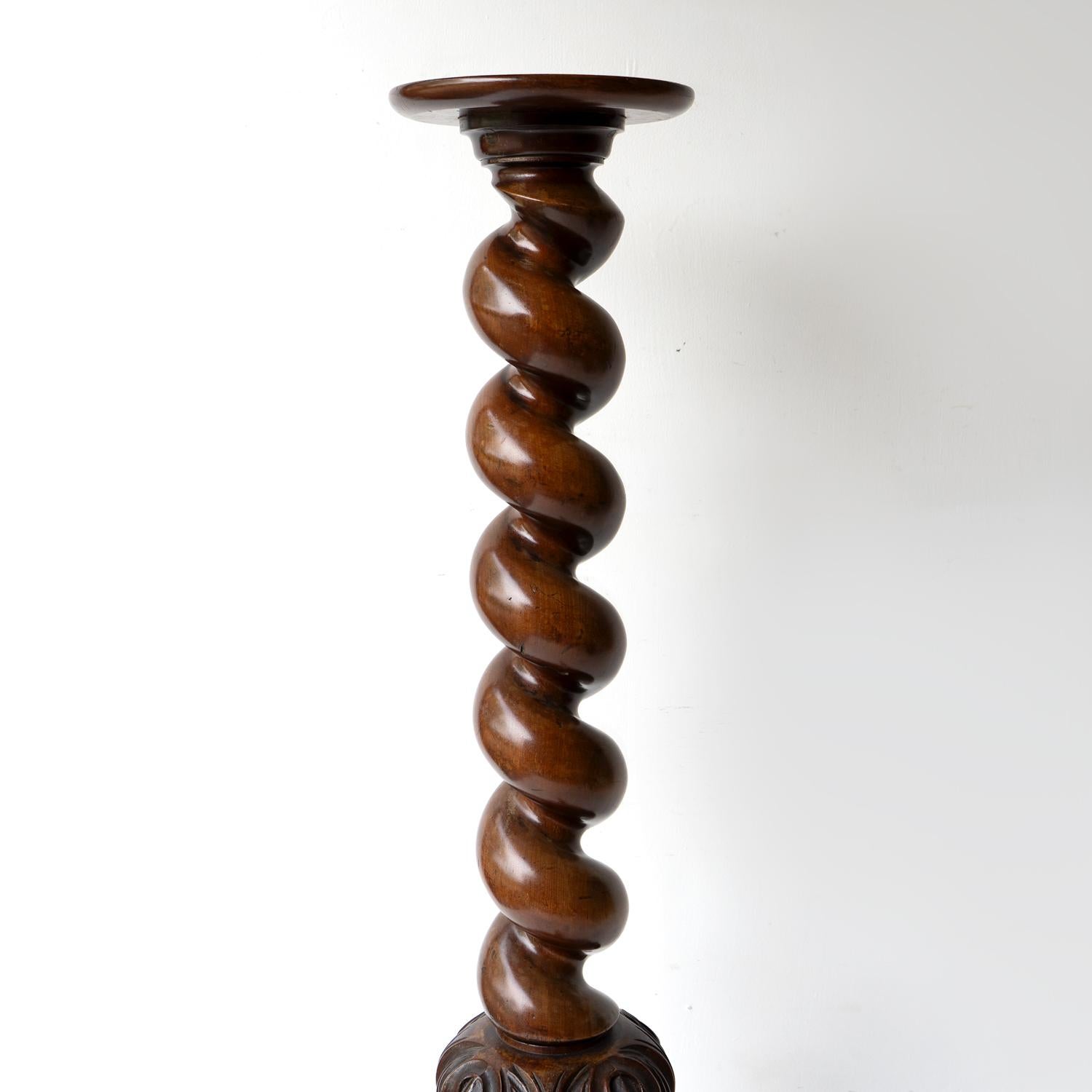 Antique Torchiere

Of unusual proportions with an oversized barely-twist stem over a bulbous carved section terminating with a tripod base with cabriole legs and slipper feet. 

A circular top which could be used to display any number of items,