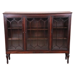 Antique Carved Mahogany Glass Front Triple Bookcase, circa 1920s