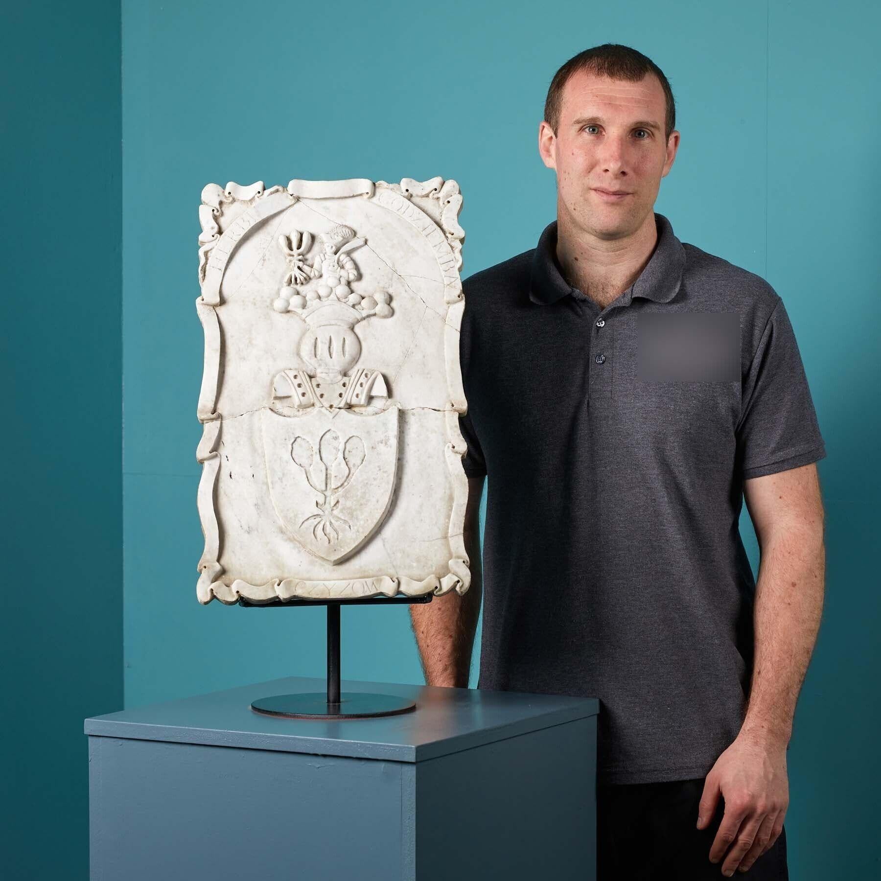Antique carved marble armorial panel. A Polish Coat of Arms. Wonderfully detailed and presented on Carrara Marble with scrolling and imagery.
The design of the plaque holds a legendary history dating back to the 11th century. The soldier depicted