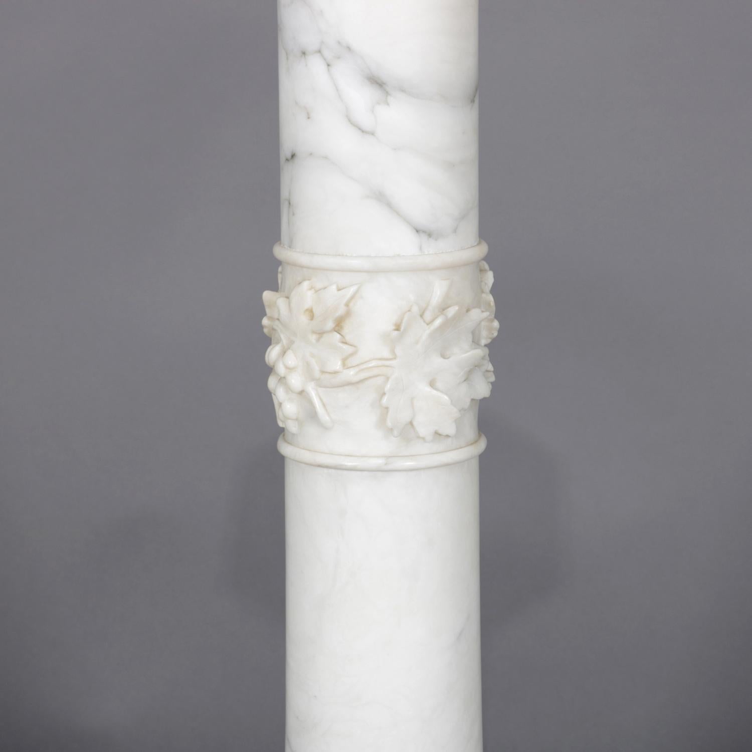 Antique marble sculpture pedestal features Classical Corinthian column-form with carved grape and leaf decoration and having clipped corner display, circa 1900.

Measures: 42