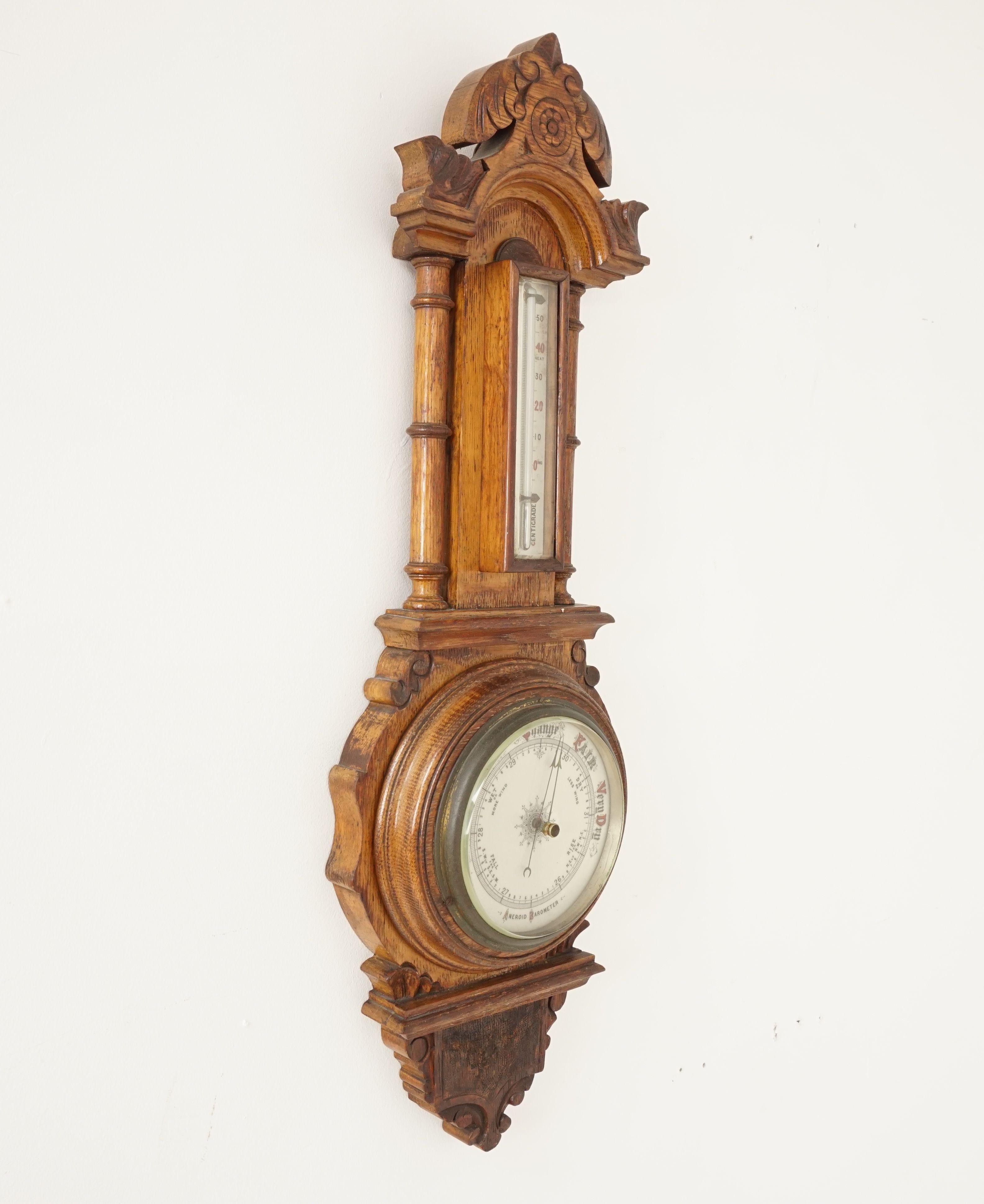 Antique carved oak barometer, Banjo Barometer, Aneroid, Scotland 1890, B2459

Scotland 1890
Solid oak
Original finish
Decorative
Carved and fretted case
Domed shaped top
Oak thermometer box below
Decorative porcelain dial to the aneroid