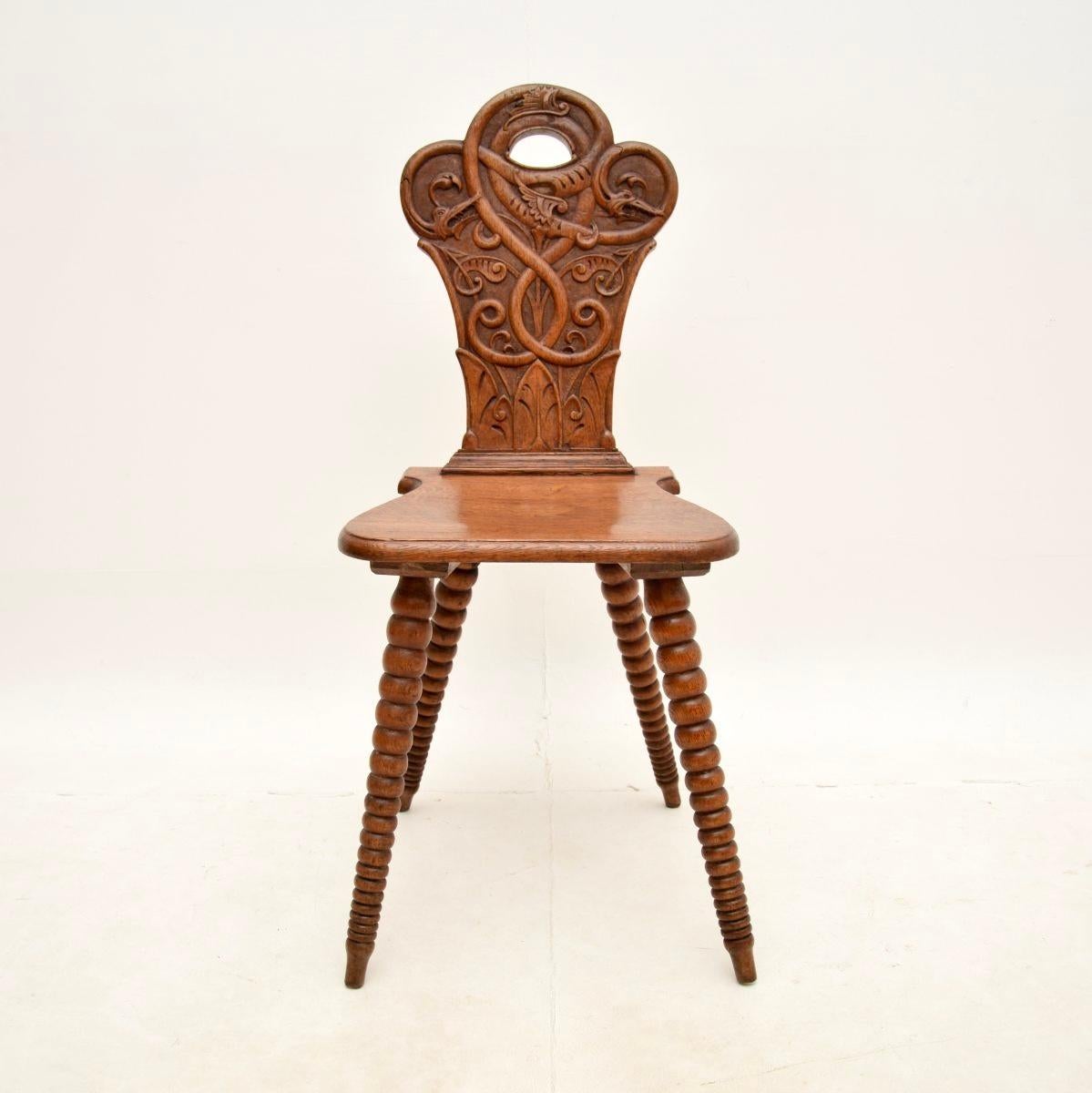 A wonderful antique carved oak bobbin chair, made in England and dating from around the 1880’s period.

It is of amazing quality, sitting on beautifully turned and splayed bobbin legs. The back rest is also beautifully carved, with fine and
