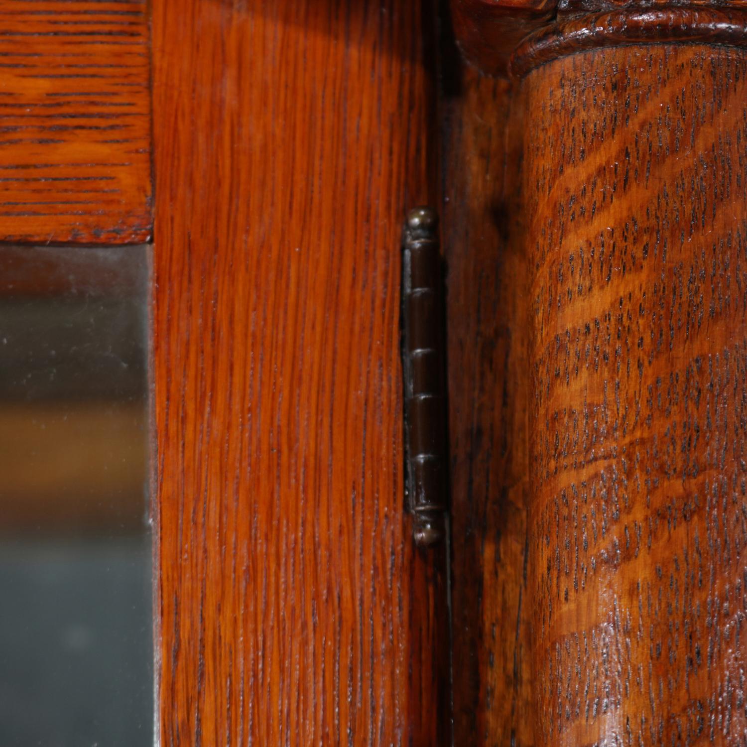 Antique Carved Oak & Curved Glass Mirror Back Paw Foot China Cabinet, circa 1910 In Good Condition In Big Flats, NY