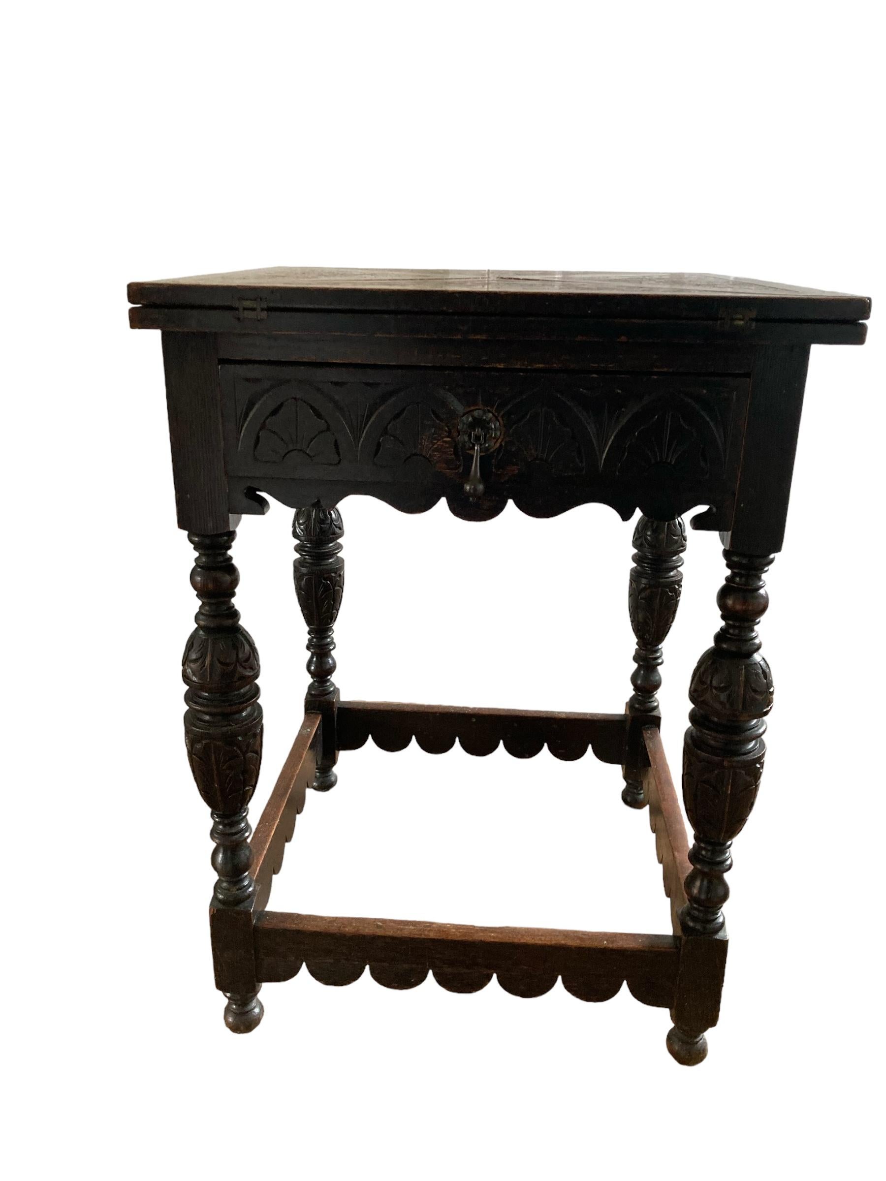 British Antique Carved Oak Envelope card Table with Single Drawer and gaming wells. For Sale