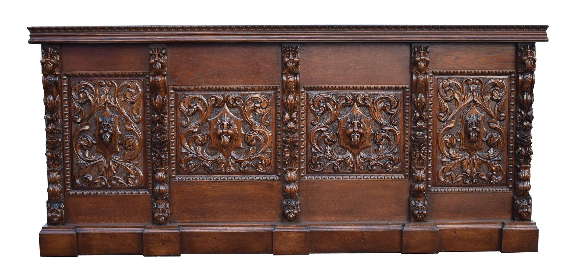 For sale is a good quality carved oak front and back bar, having a stepped and flared cornice above three beveled mirrors flanked by stained glass panels. The back bar has an arrangement of three drawers, three shelves and a lead lined bottle