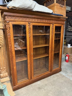 Antique Carved Oak Glass Front Three Door Bookcase