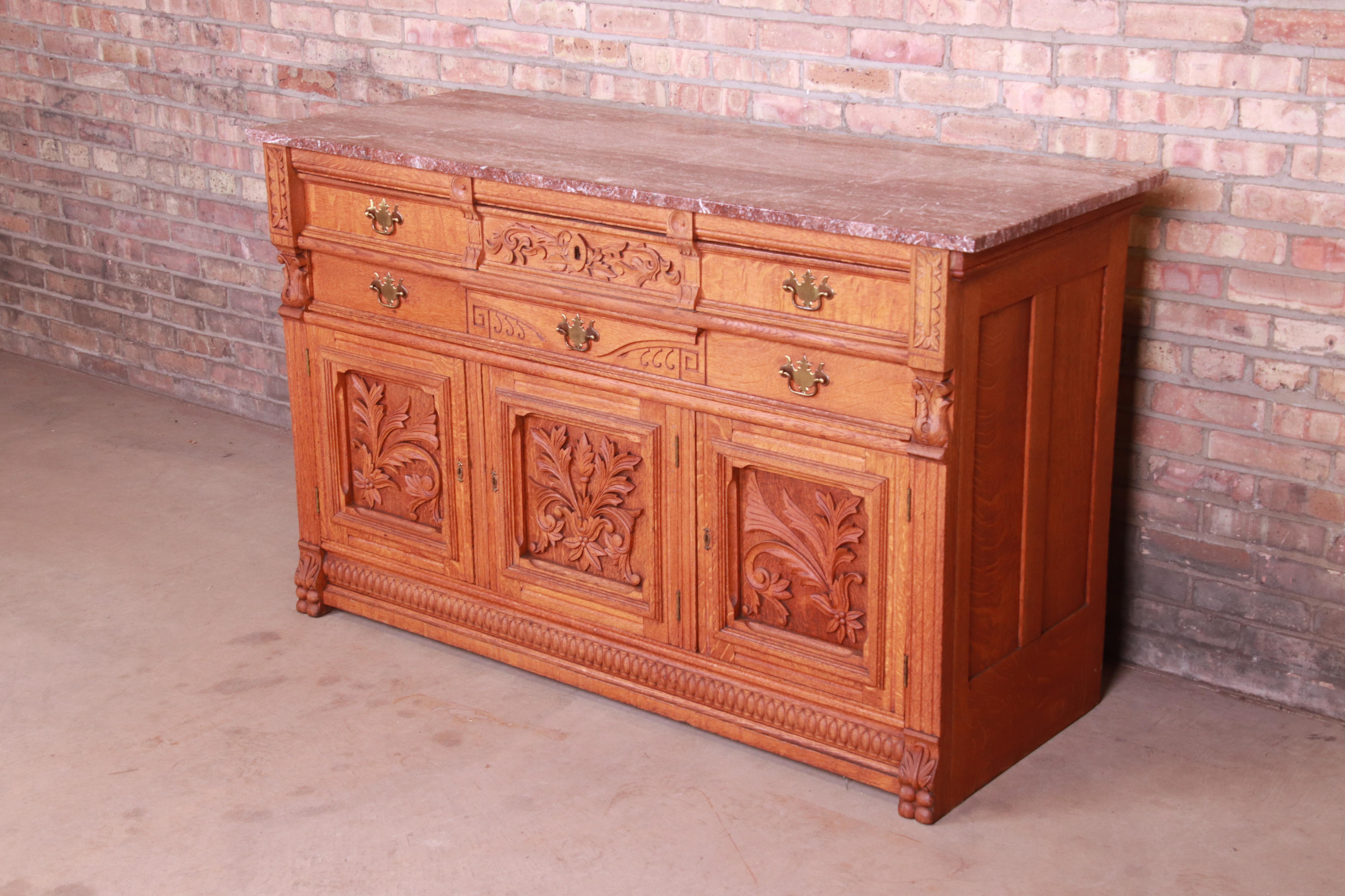 American Antique Carved Oak Marble Top Sideboard Attributed to Horner, circa 1890s