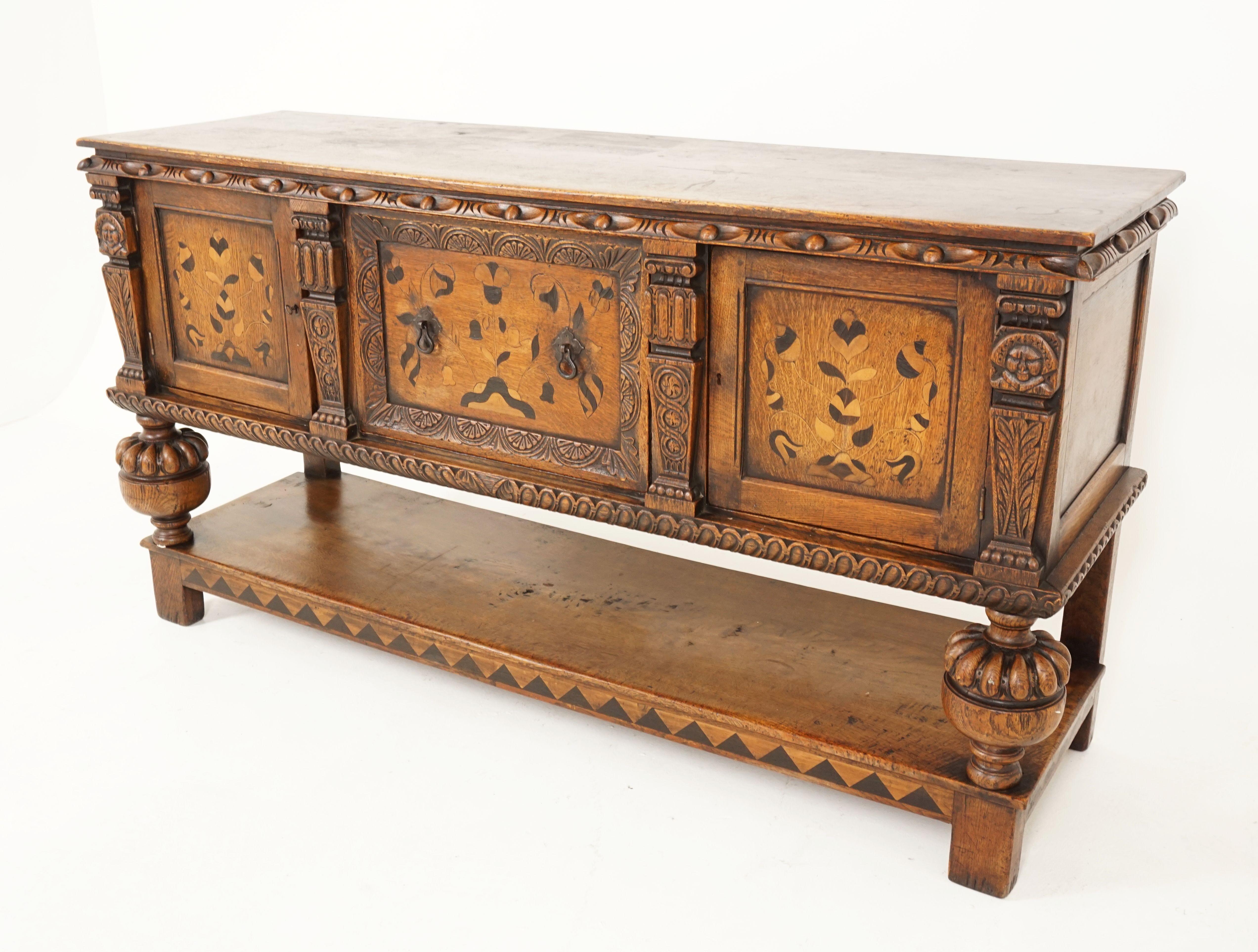 Antique carved oak sideboard, inlaid buffet, Scotland 1910, B2528

Scotland 1910
Solid oak + veneer
Original finish
Rectangular moulded top
Carved frieze underneath
Carved inlaid single drawer to the middle
With inlaid cupboards to each