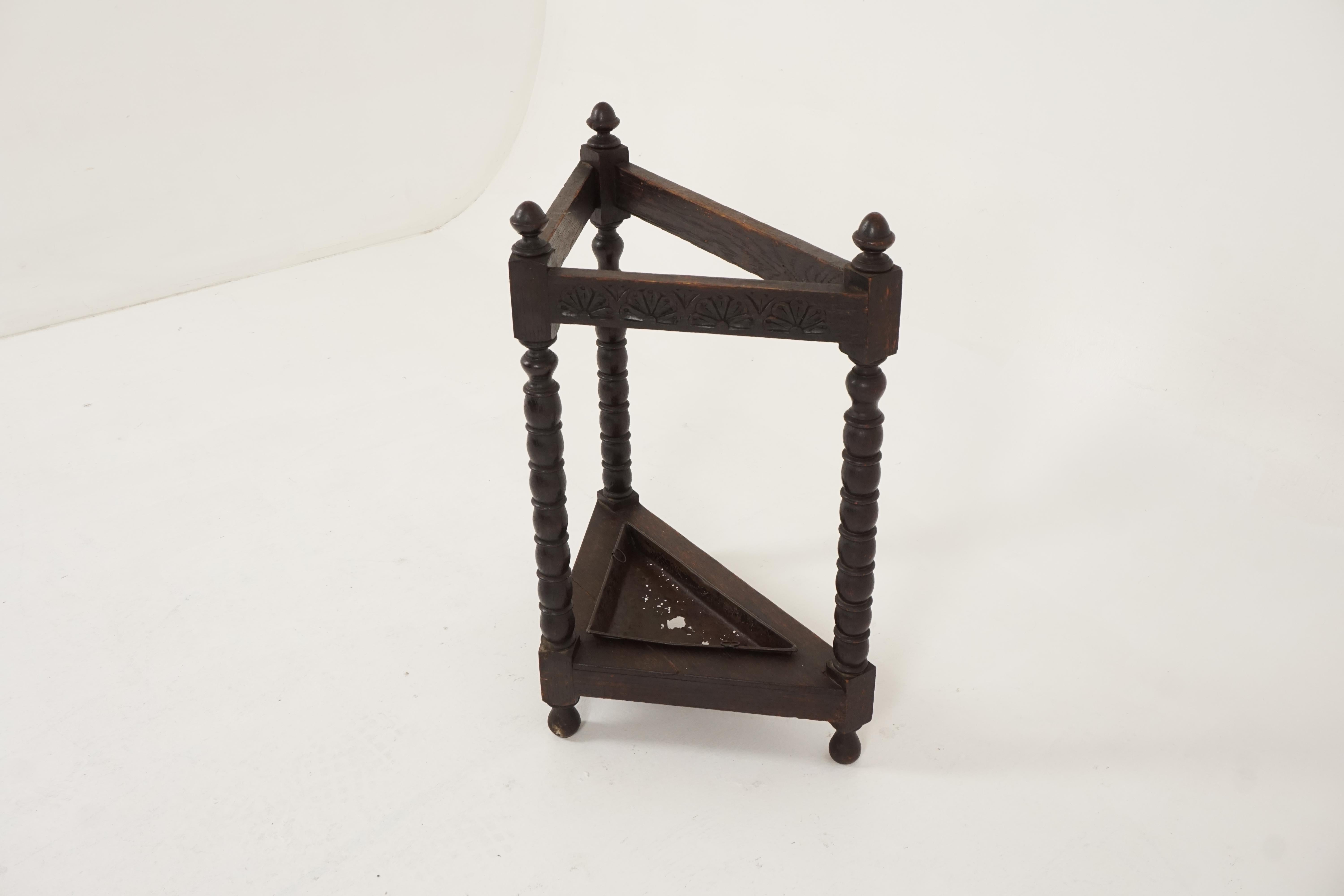 Antique oak stick stand, carved oak triangular stick stand and tray, Scotland 1890, B2242

Scotland, 1890
Solid oak
Original finish
Finials to the top
Carved rail on all three sides
Standing on three turned bobbin legs
With original metal