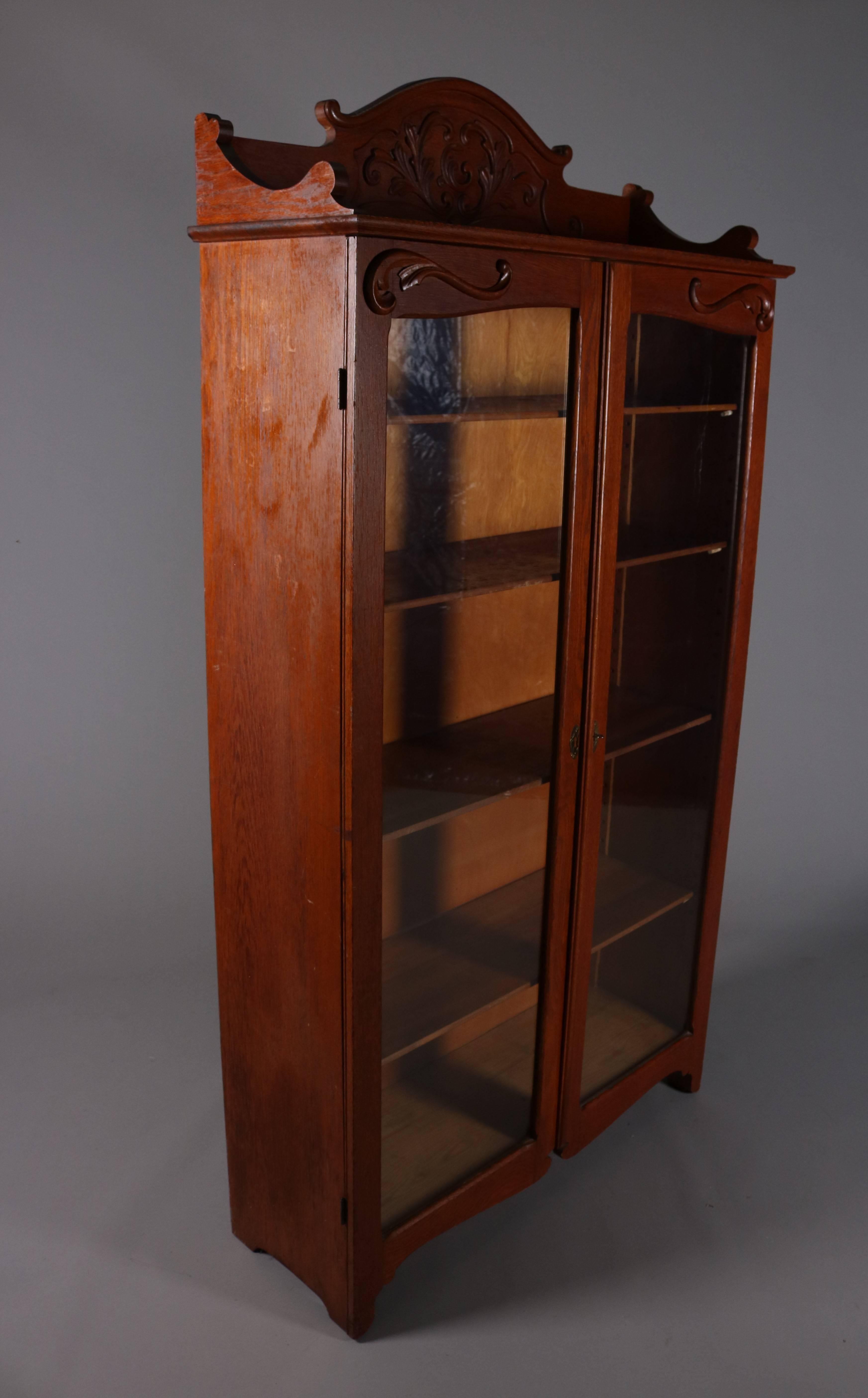 Antique Carved Oak Two-Door Bookcase with Acanthus and Scroll Decoration In Good Condition In Big Flats, NY