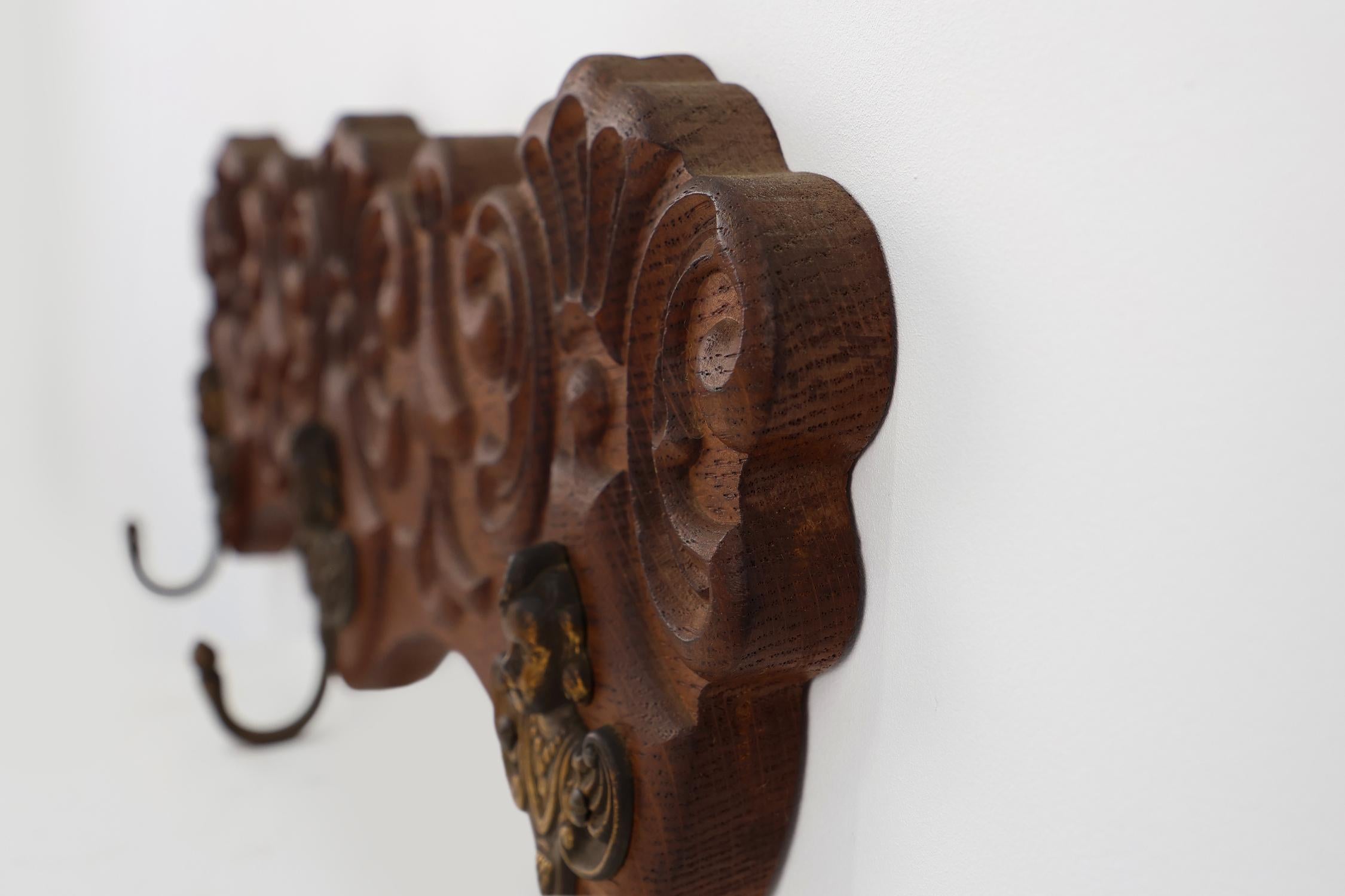 Early 20th Century Antique Carved oak Wall mount coat rack with 3 brass angel hooks, France 1900s For Sale