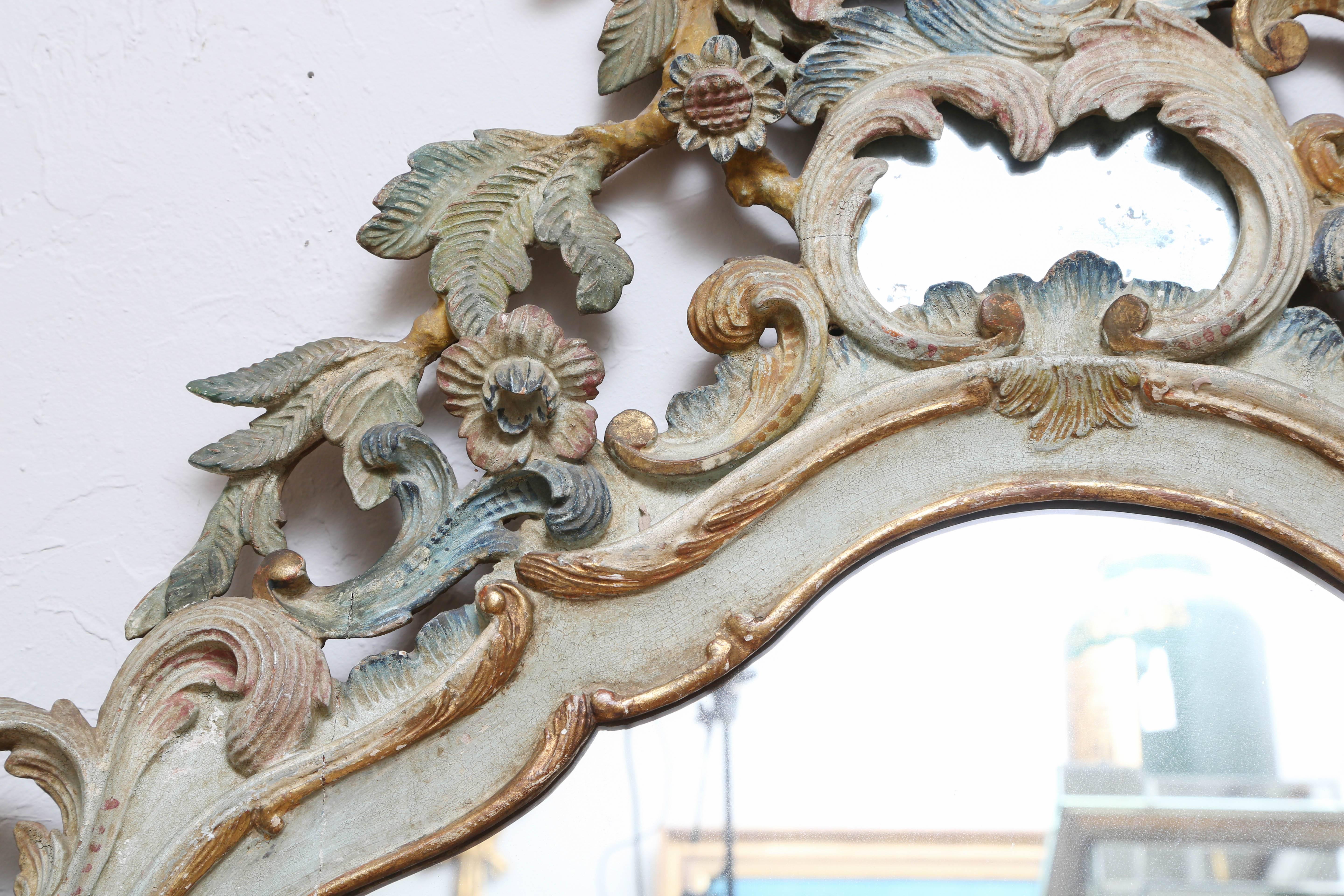 Hand-carved Baroque style mirror with painted finish in a lovely patina.