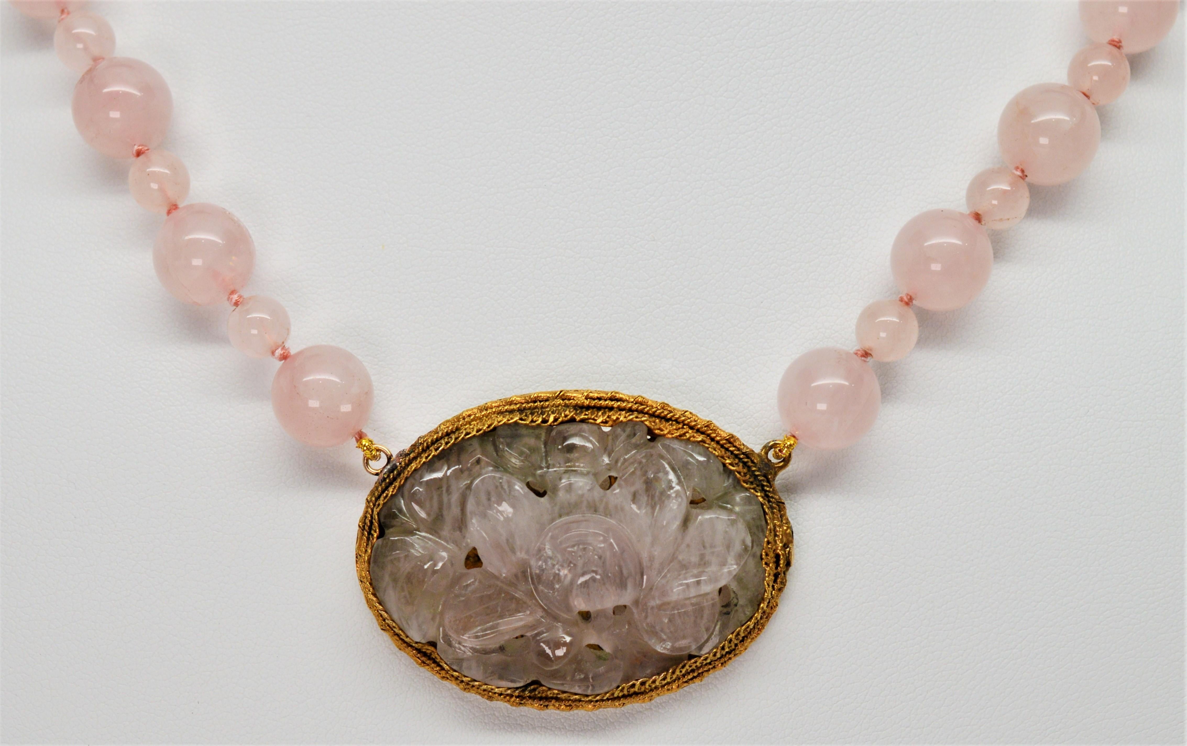 carved rose quartz pendant