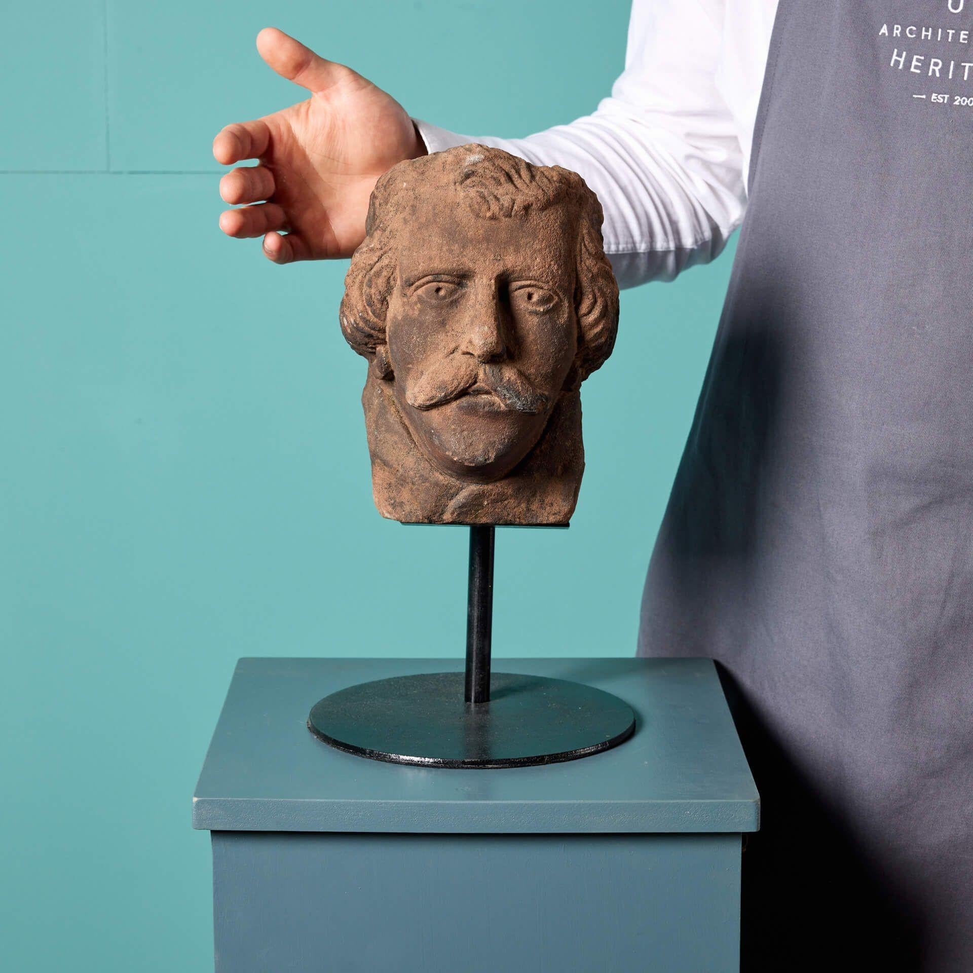Antique carved sandstone head dating back to 1800. This carefully crafted piece has certainly stood the test of time - at 200 years old the details of this distinguished gentlemen are still very much intact. He is a moustached man, with a Victorian