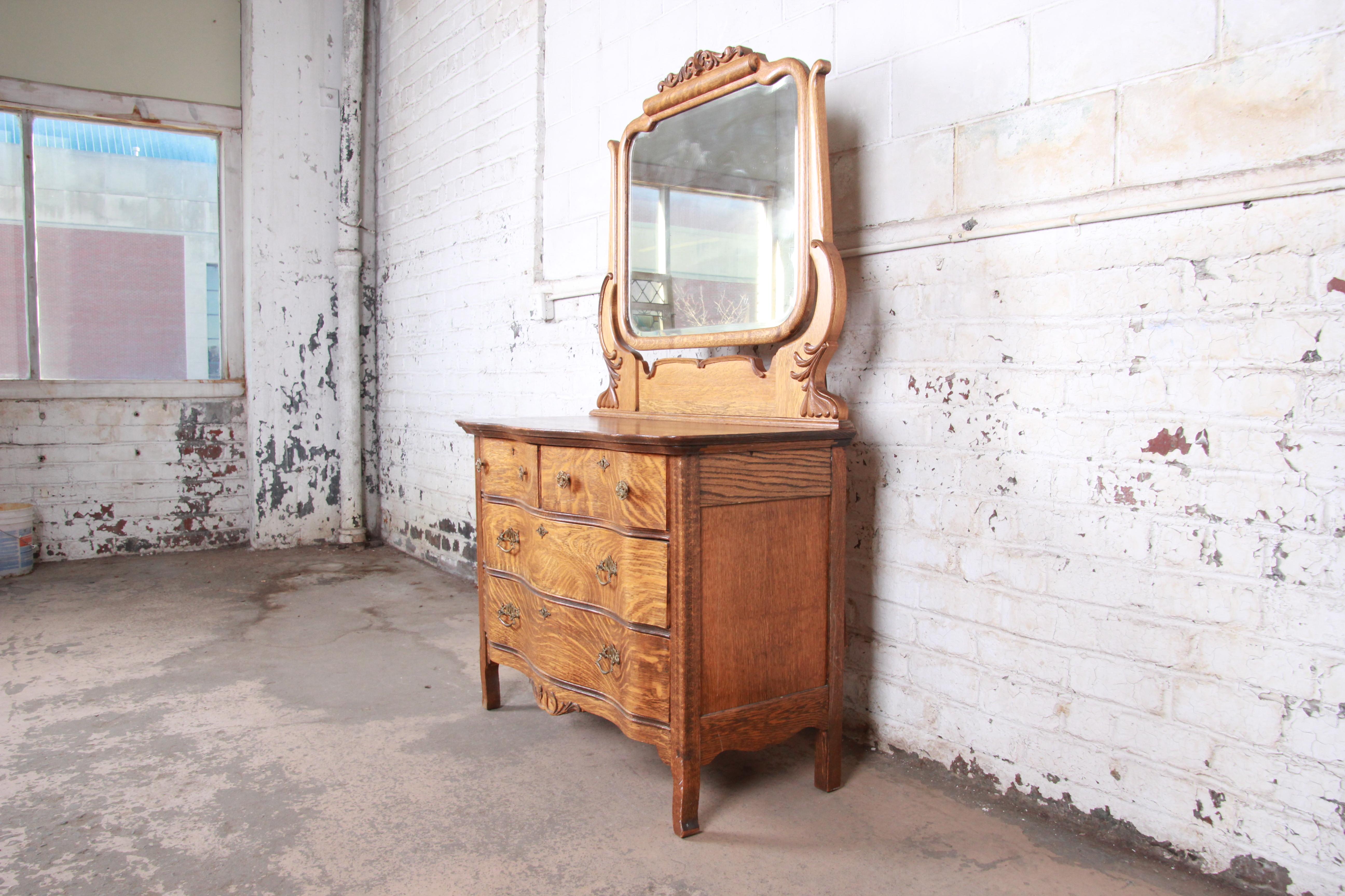 An exceptional antique carved tiger oak dresser with mirror

USA, circa 1900

Tiger oak + mirror + original brass hardware

Measures: 43