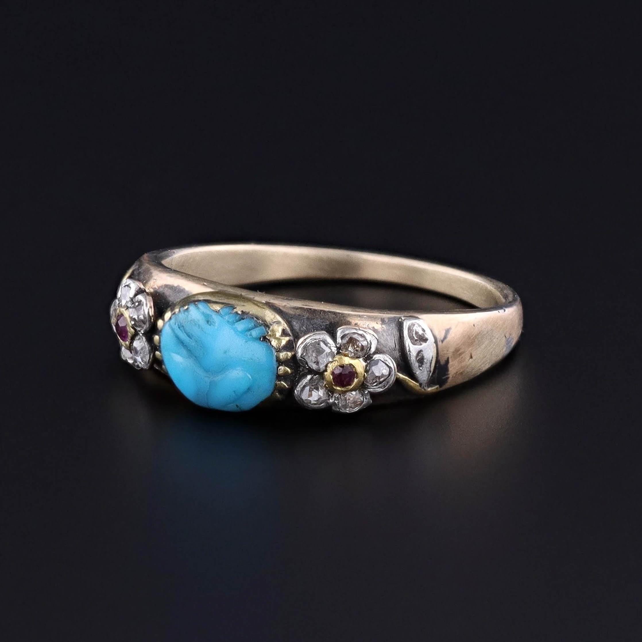 Antique Georgian Era Fede Ring – Carved Turquoise Hands with Diamond & Ruby Flowers in 15ct Gold: This exquisite Georgian-era fede ring is a rare and romantic treasure, featuring two intricately carved turquoise hands clasped in an eternal bond of