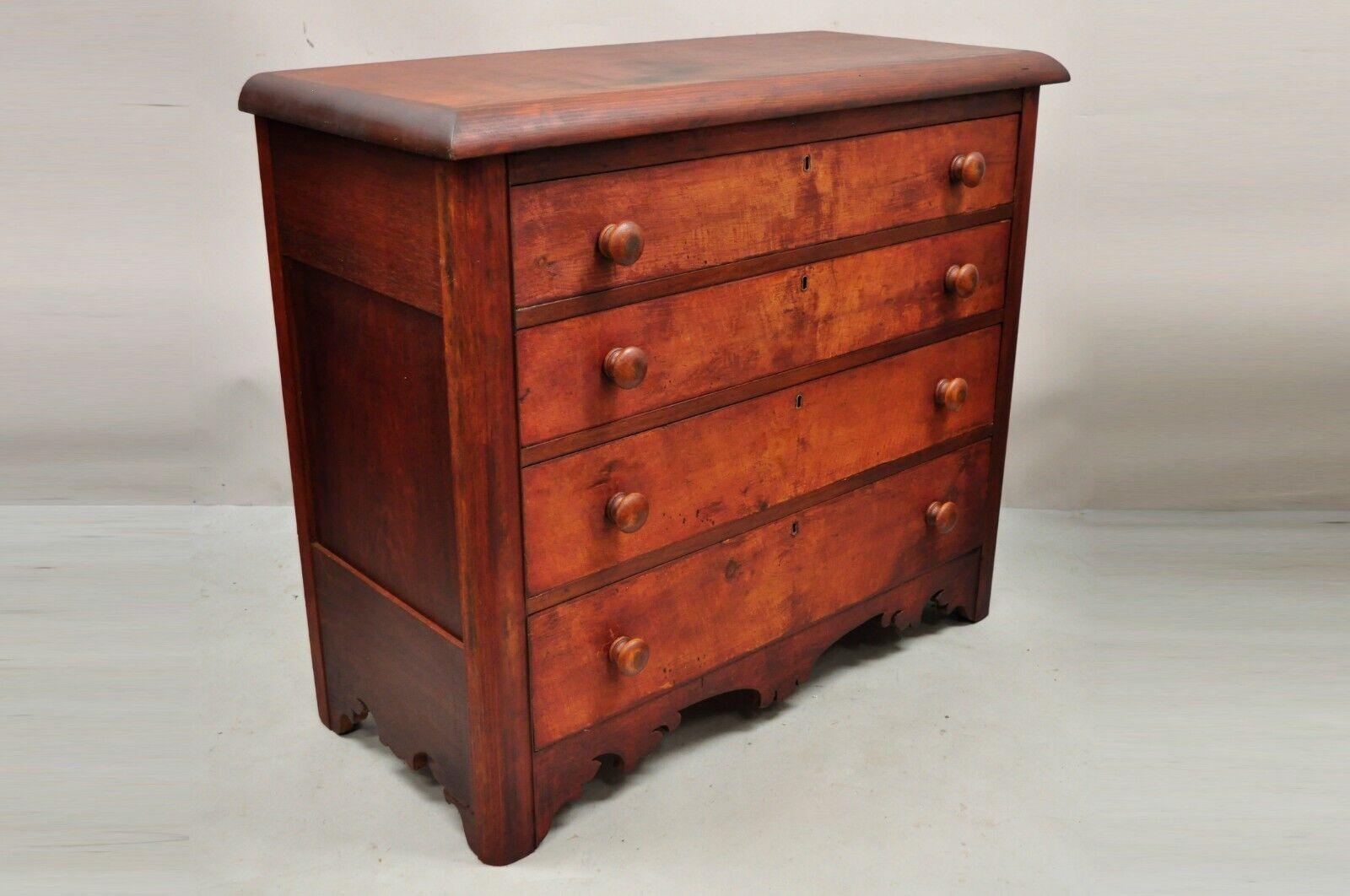 Antique carved Victorian pine wood 4 drawer dresser chest red finish. Item features a carved lower skirt, reddish washed finish, distressed finish, 4
dovetailed drawers, no key, but unlocked, very nice antique item. Circa 19th Century.