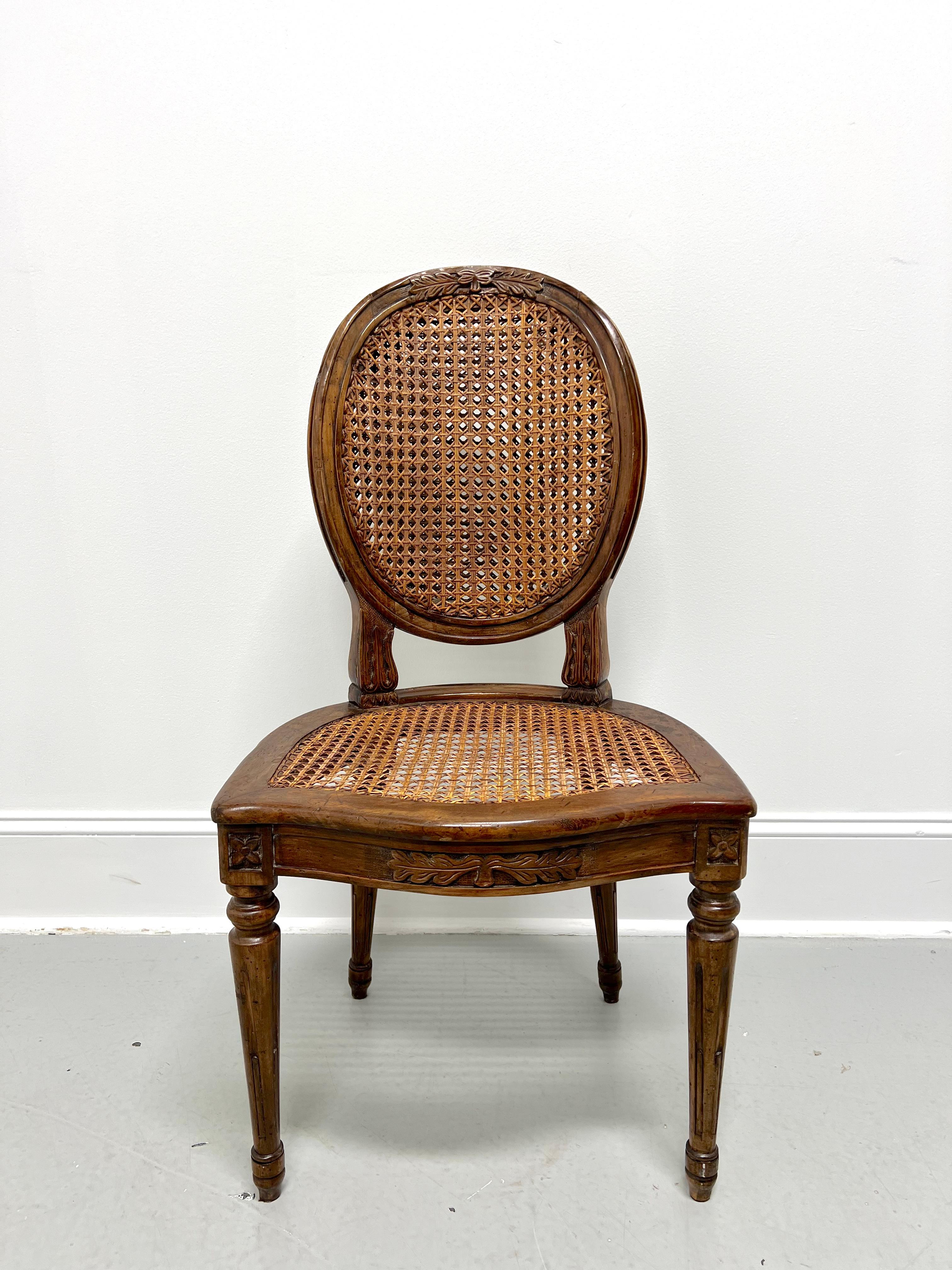 An antique side chair in the Italian Provincial style, unbranded. Solid walnut, balloon back with a decoratively embellished crest rail, woven caned back & seat, decoratively embellished apron & knees, fluted tapered straight front legs, and spade