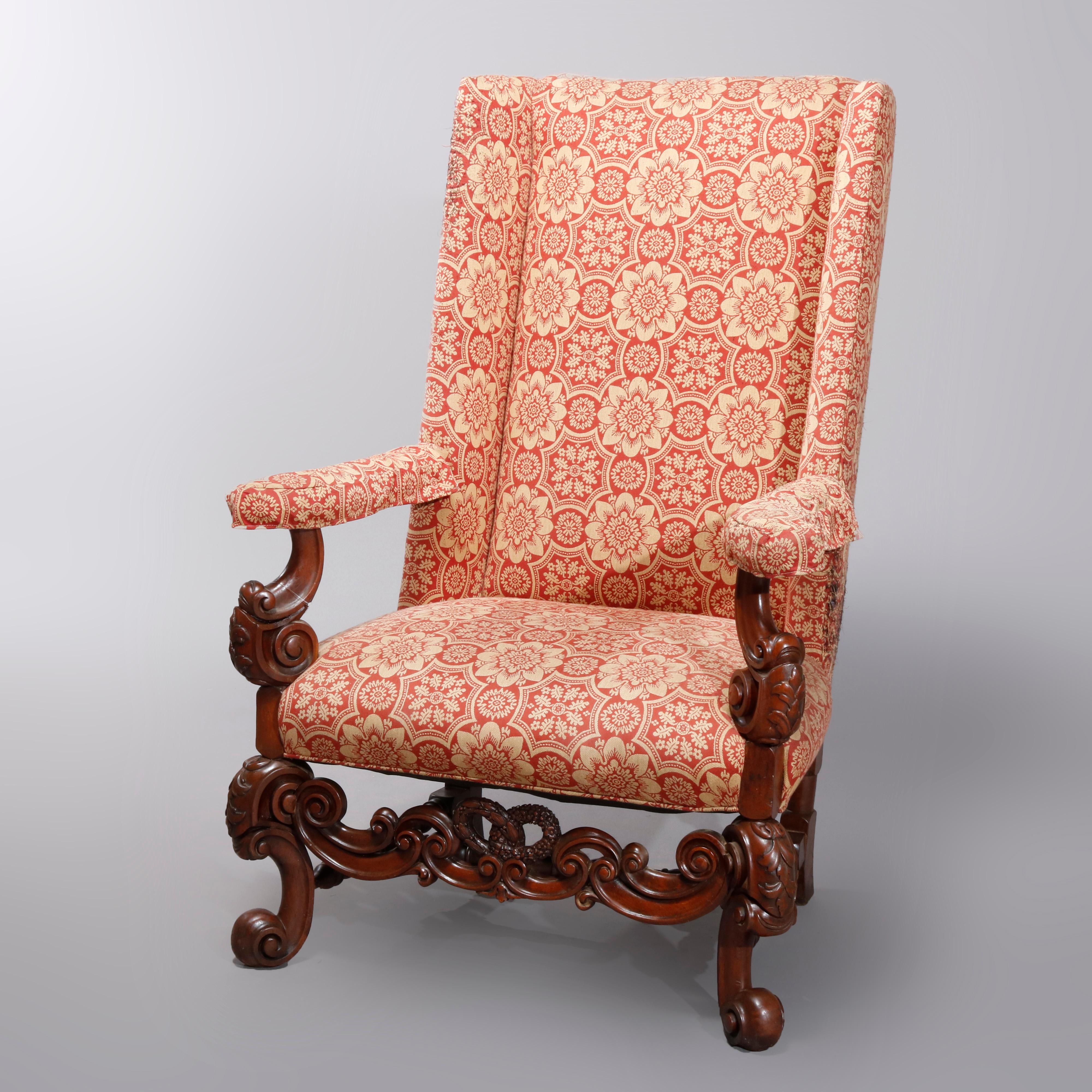 An antique Continental baroque tall fireside armchair offer upholstered high wing back and seat with carved walnut frame having scroll form flared arms, cabriole legs and stretcher, and newly upholstered, circa 1910

Measures: 49.5