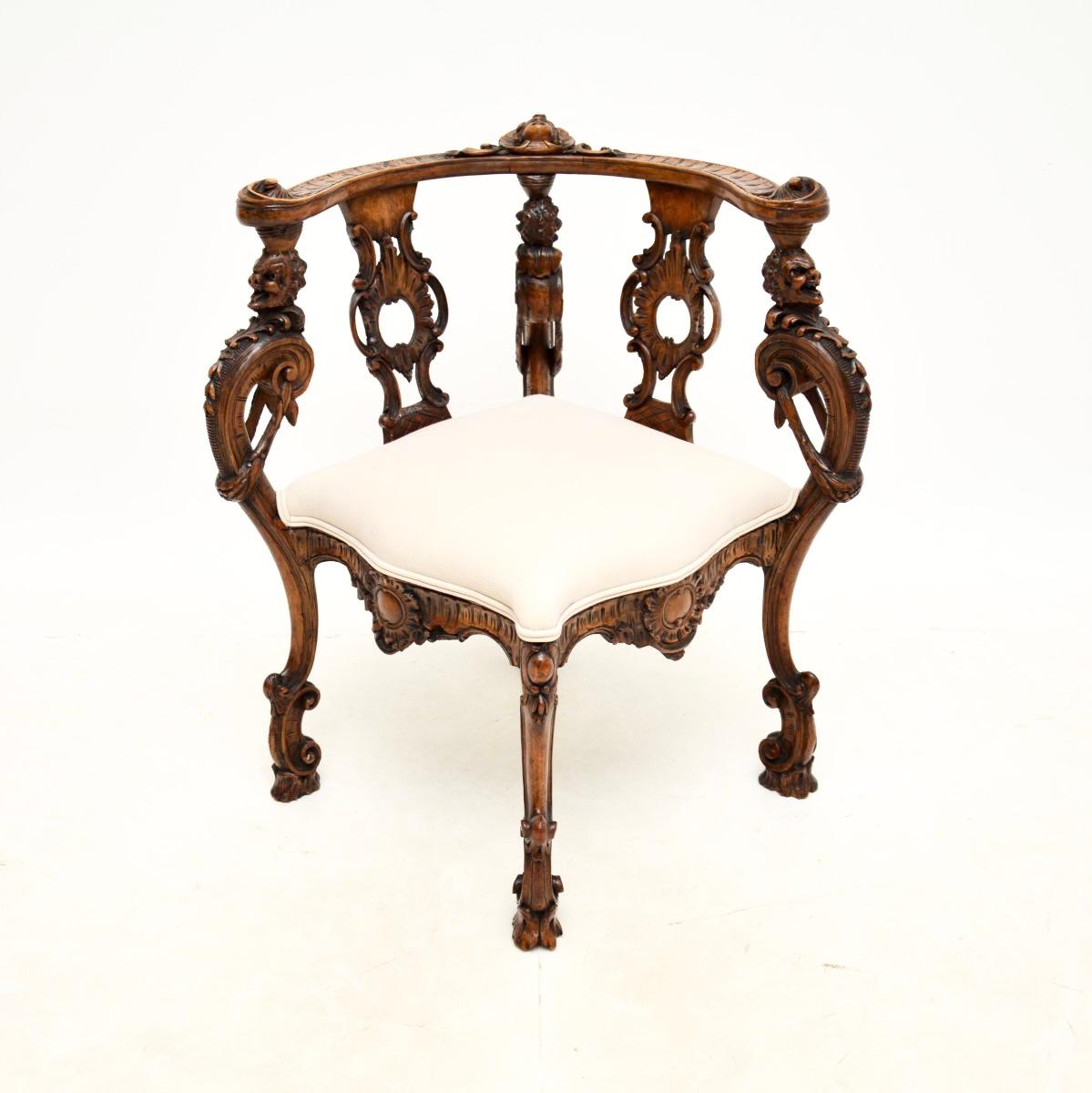 A beautiful and impressive antique carved walnut corner chair. This was most likely made in Italy, we would date it to around the 1790’s period.

It is of extremely fine quality, with crisp and interesting carving, including gargoyles around the